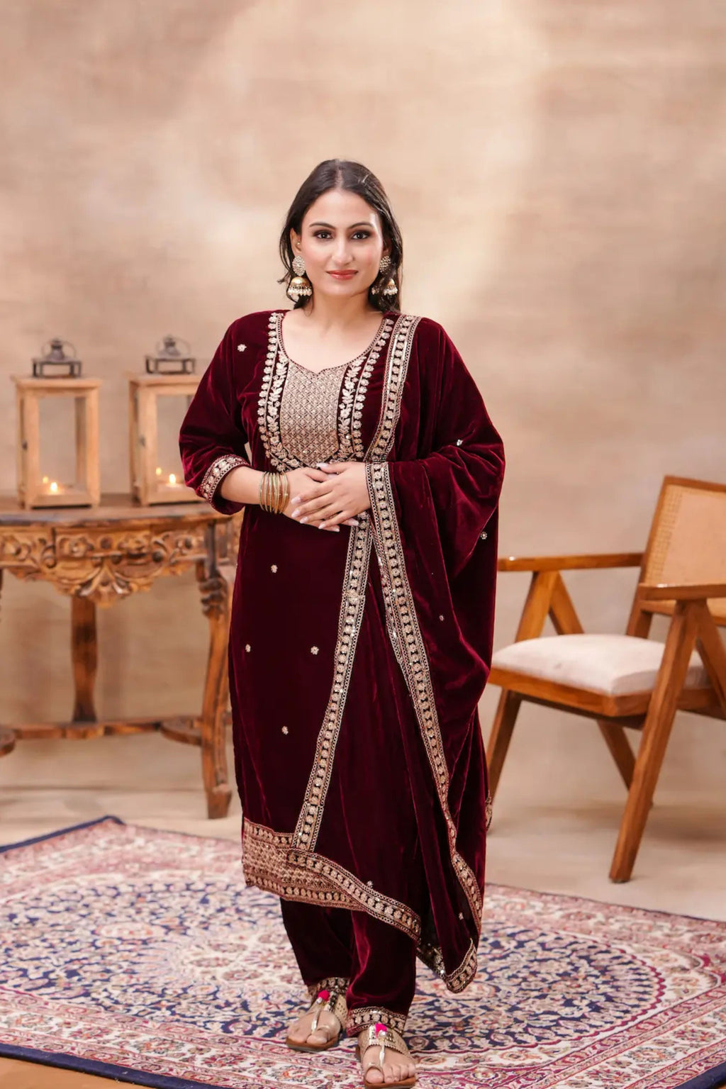 Royal maroon velvet embroidered suit set by Shuchi Man, featuring intricate embroidery and a luxurious velvet fabric.