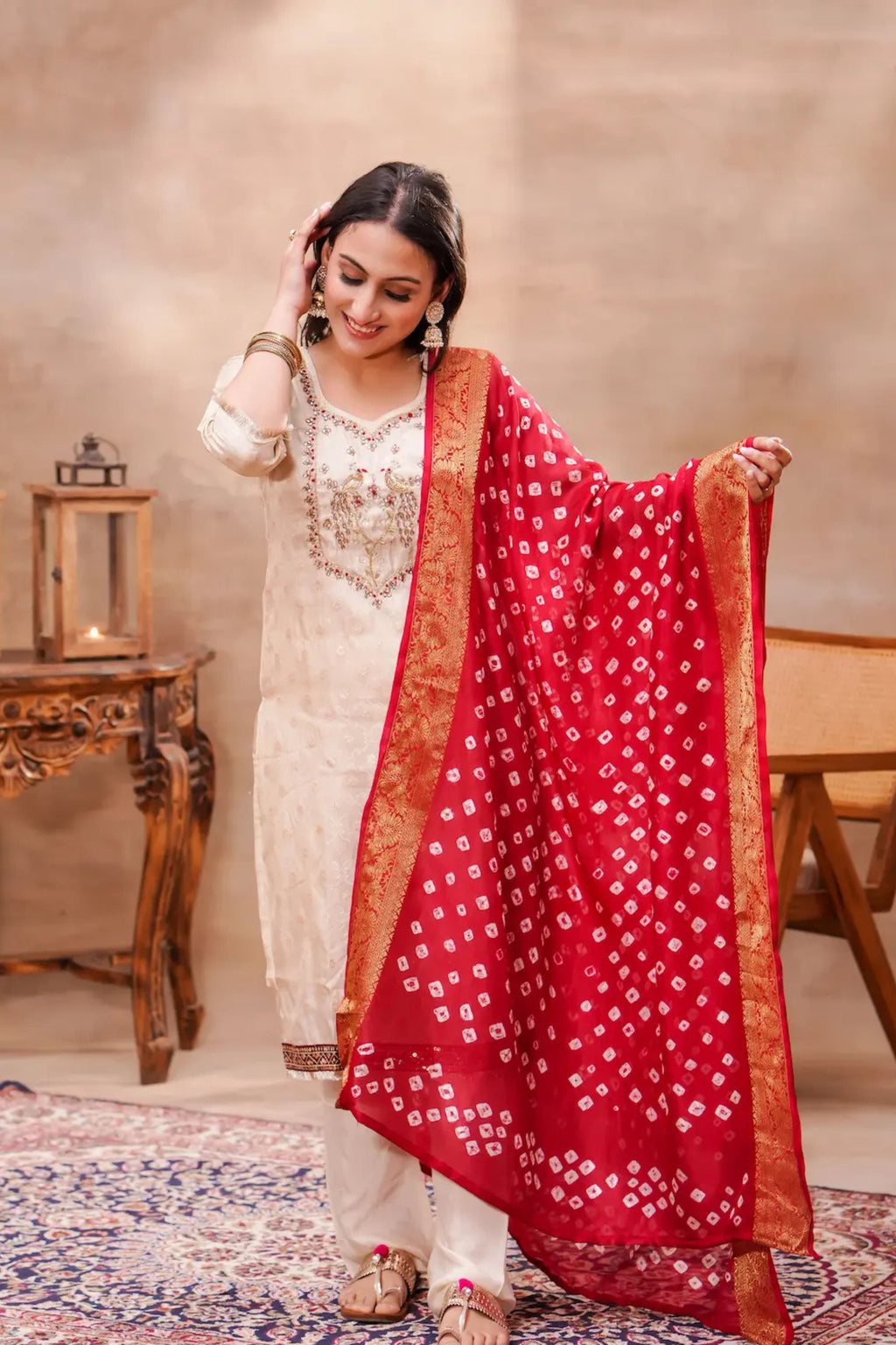 Ivory silk kurta set with intricate Bandhani dupatta, traditional Indian attire by Shuchi Man, showcasing elegant craftsmanship.
