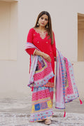 Shuchi Man Rani Pink kurta set with floral sharara pants and matching dupatta, featuring intricate embroidery and vibrant design.