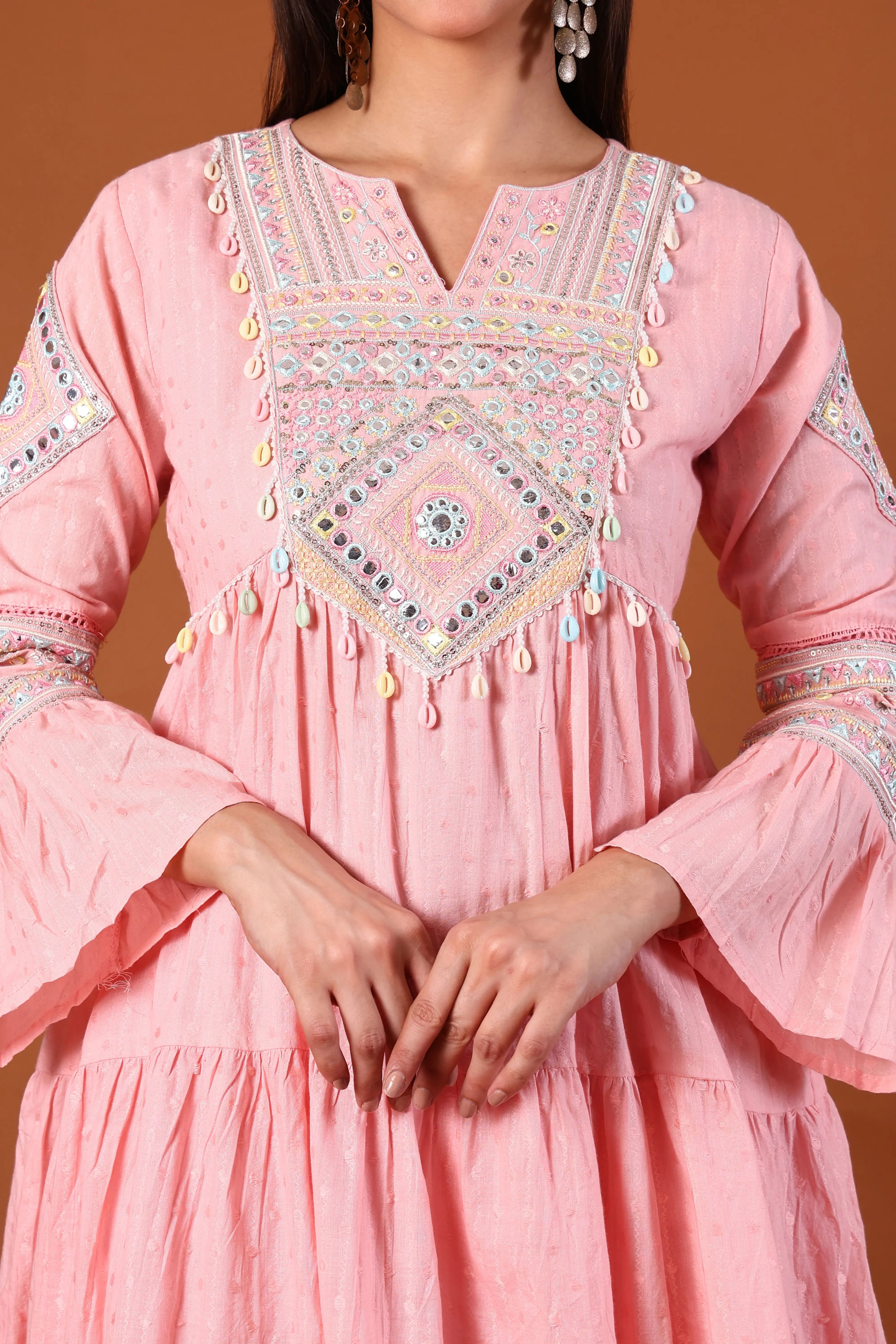 Blush cotton kurta set by Shuchi Man with kauri embellishments, featuring intricate embroidery and traditional design.