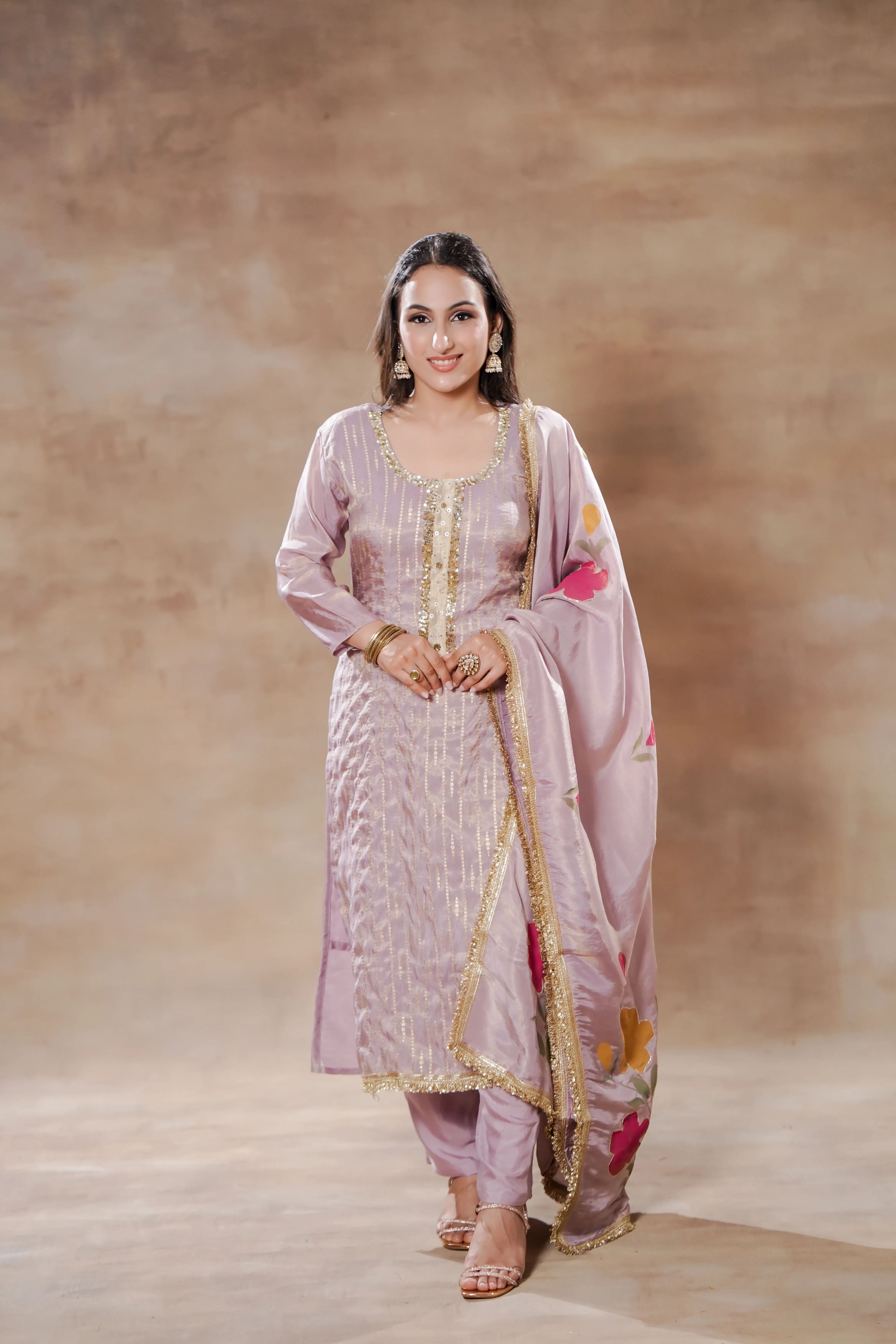 Lavender Radiance Tissue Silk Kurta Set by Shuchi Man displayed on a mannequin with intricate embroidery and matching dupatta.