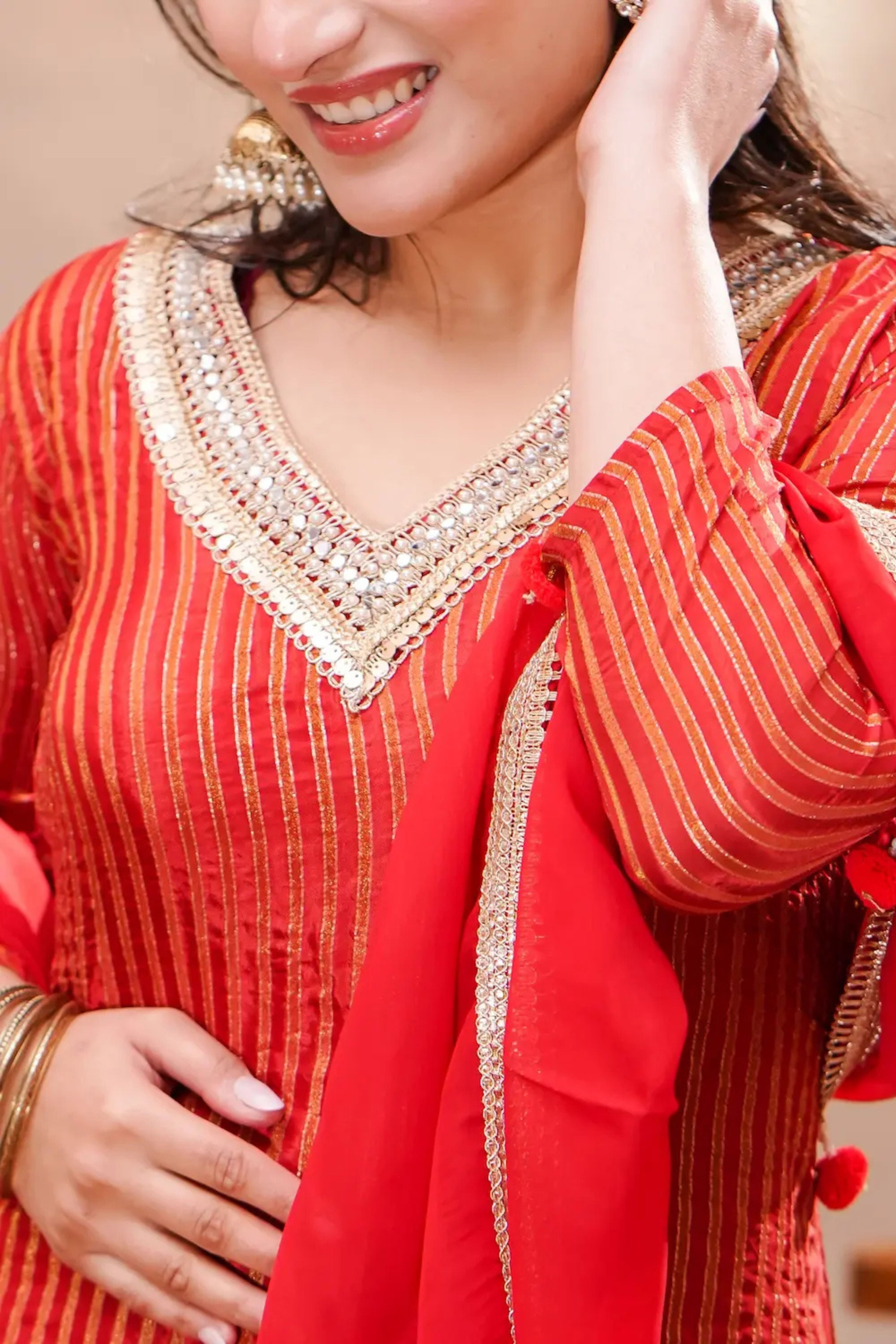 Crimson silk kurta set with matching dupatta by Shuchi Man, featuring intricate embroidery and elegant traditional design.