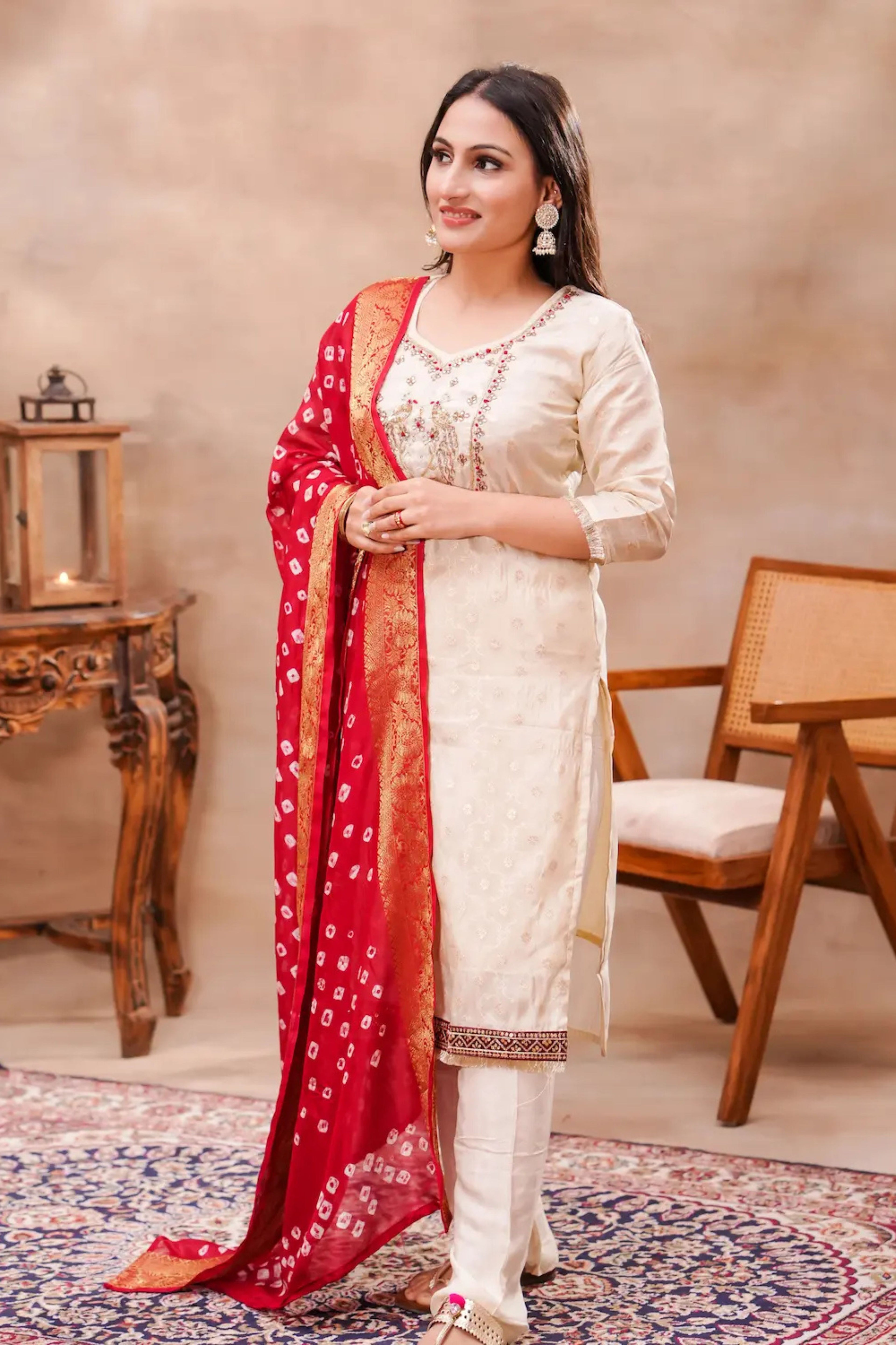 Ivory silk kurta set with intricate bandhani dupatta by Shuchi Man, featuring a traditional and elegant ethnic outfit.