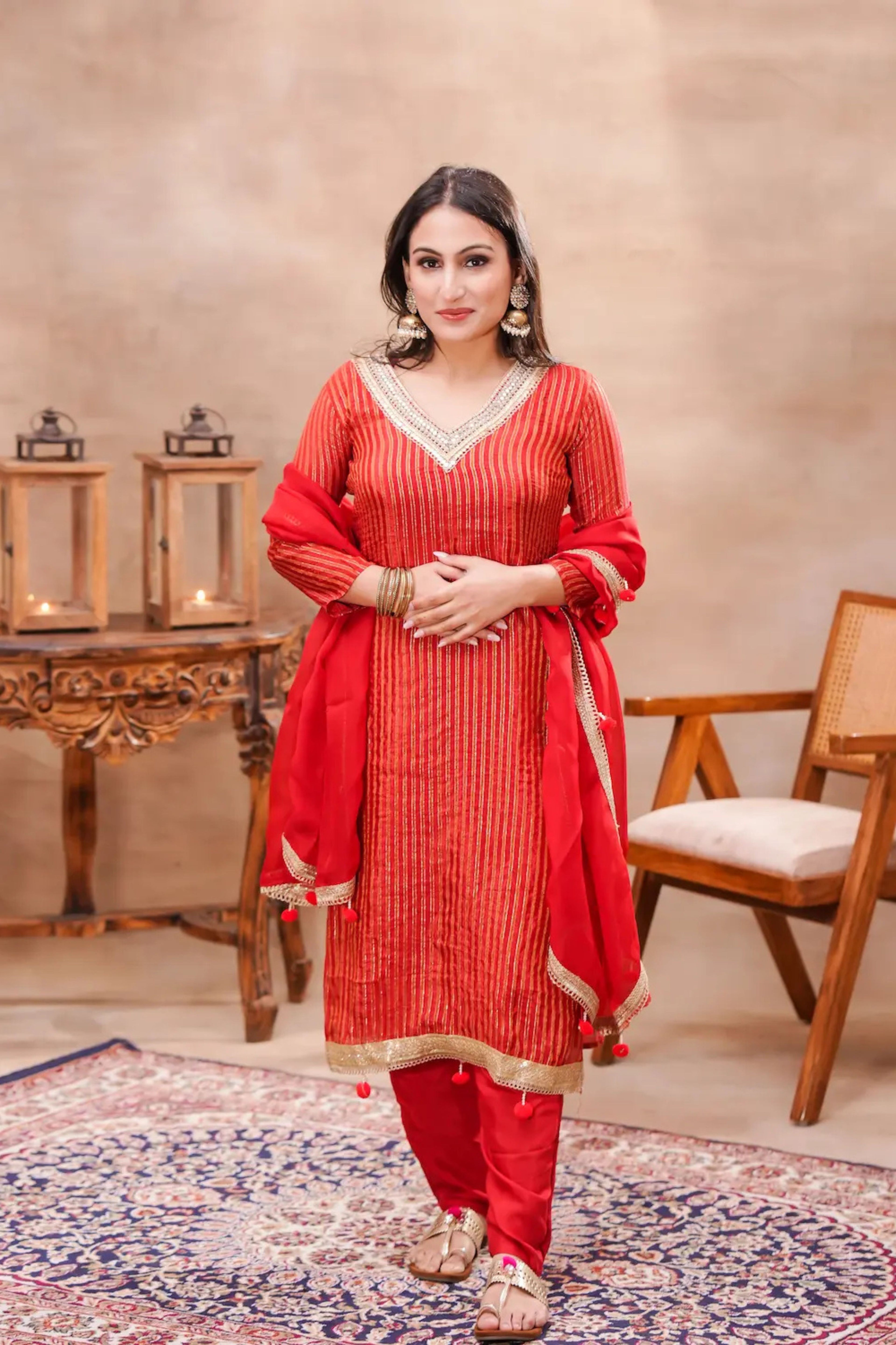 Crimson Grace silk kurta set with matching dupatta by Shuchi Man, featuring elegant embroidery and traditional design.