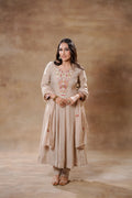 Beige Bloom silk Anarkali set by Shuchi Man featuring intricate embroidery and flowing fabric.