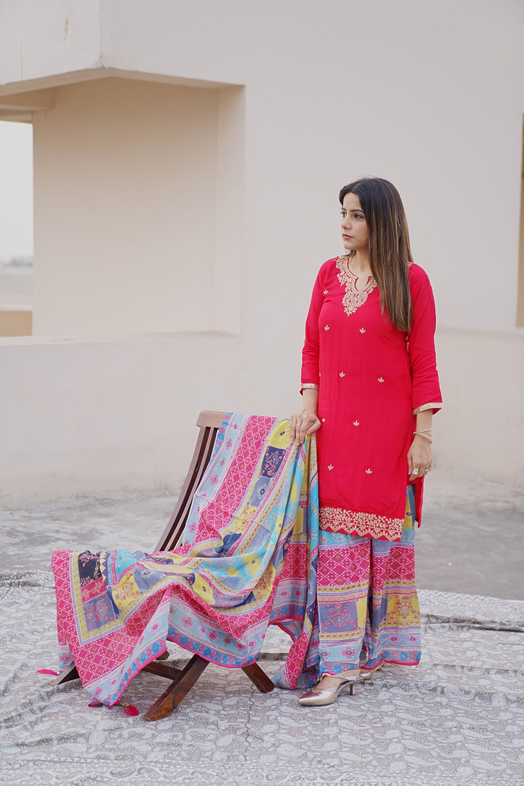 Shuchi Man Rani Pink Kurta set with floral sharara and matching dupatta, featuring intricate embroidery and vibrant design.