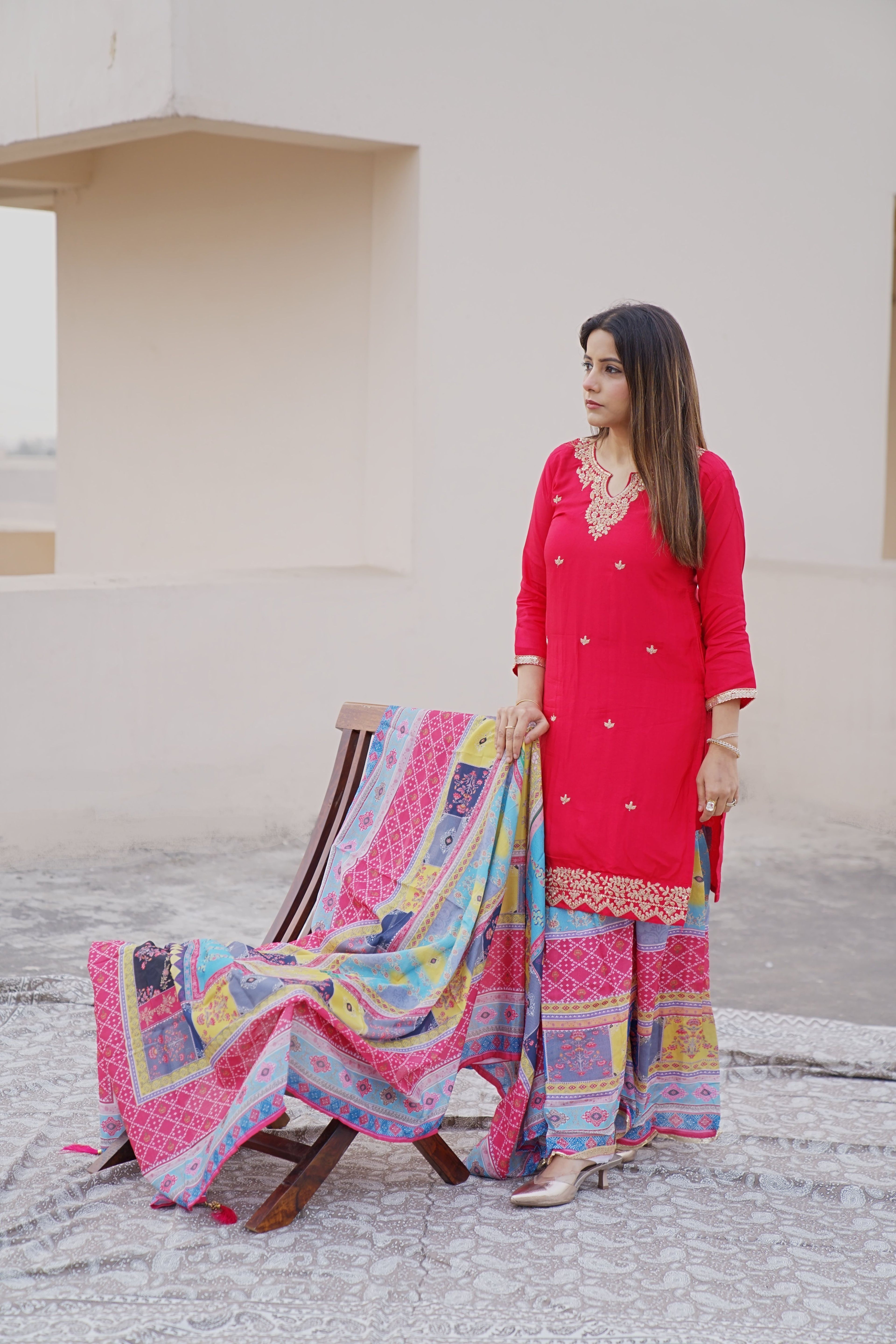 Shuchi Man Rani Pink Kurta set with floral sharara and matching dupatta, featuring intricate embroidery and vibrant design.