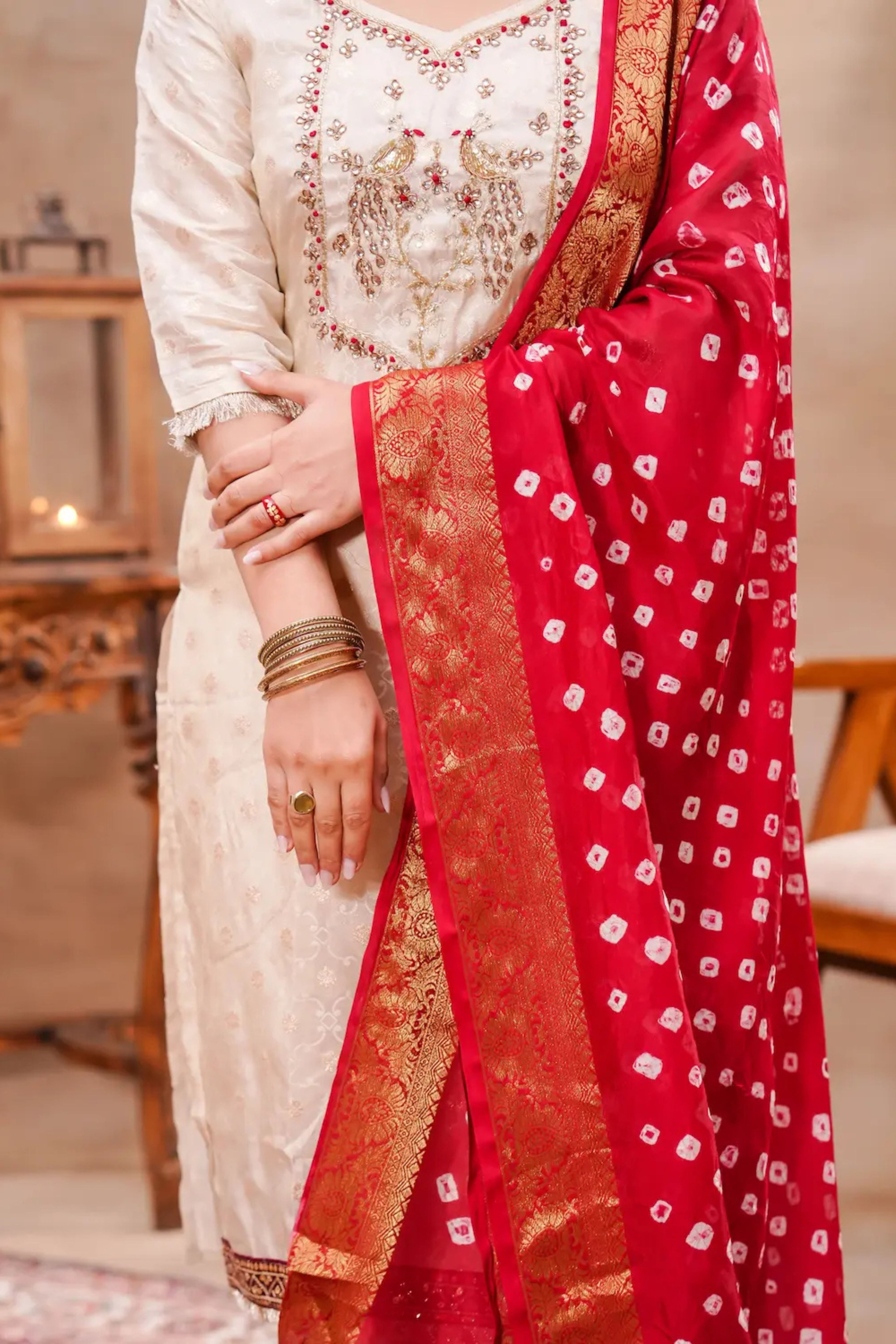 Ivory silk kurta set with intricate Bandhani dupatta by Shuchi Man, featuring elegant traditional Indian design.