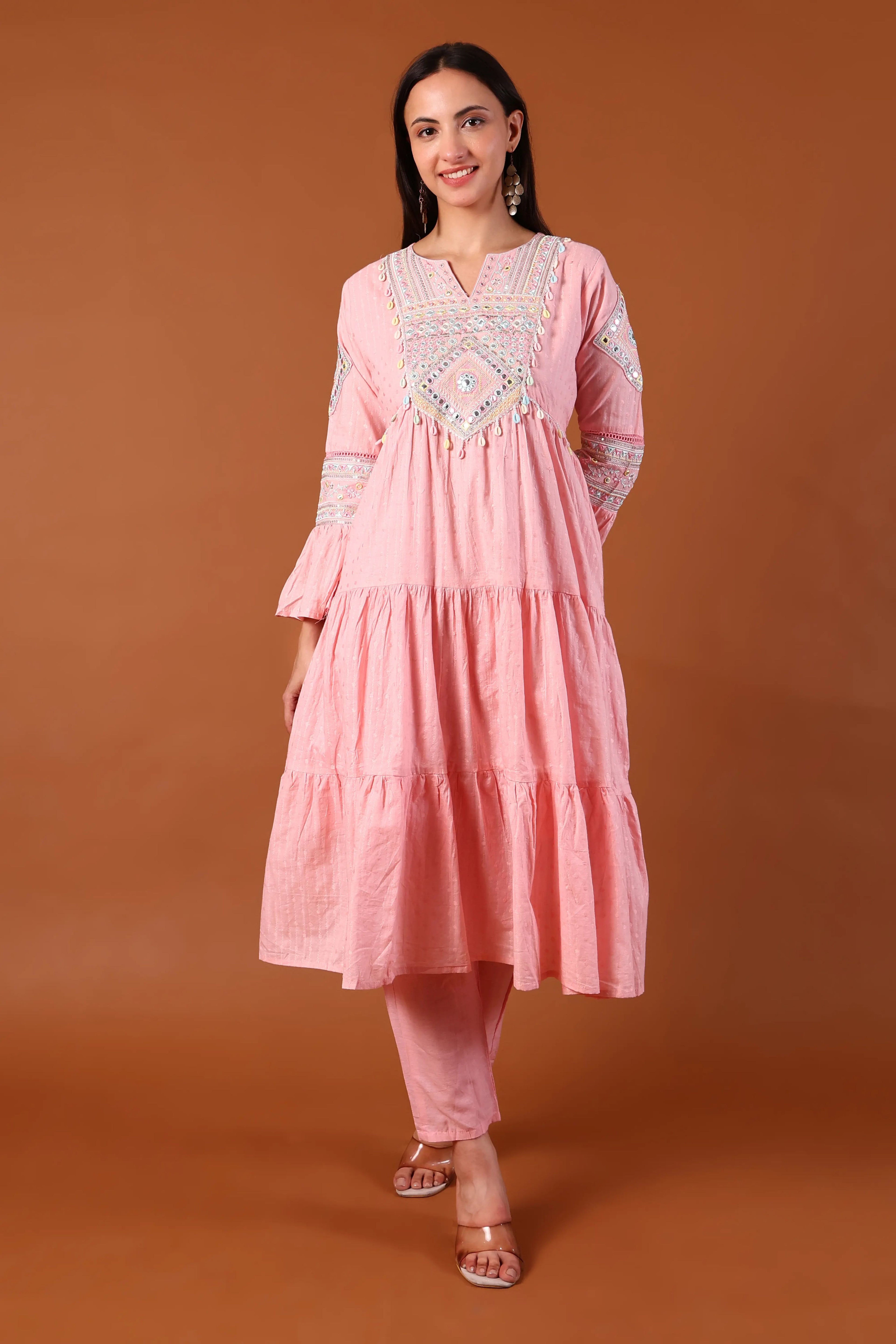 Blush cotton kurta set with Kauri embellishments by Shuchi Man, featuring intricate embroidery and a traditional design.