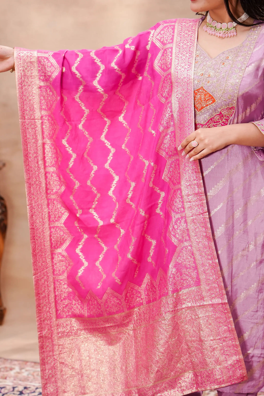 Lavender silk kurta with intricate embroidery and a matching Banarasi dupatta by Shuchi Man, displayed on a hanger.