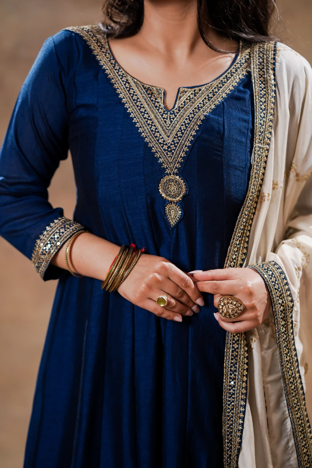 Midnight blue silk Anarkali with ivory dupatta by Shuchi Man, detailed embroidery and flowing fabric, traditional Indian attire.