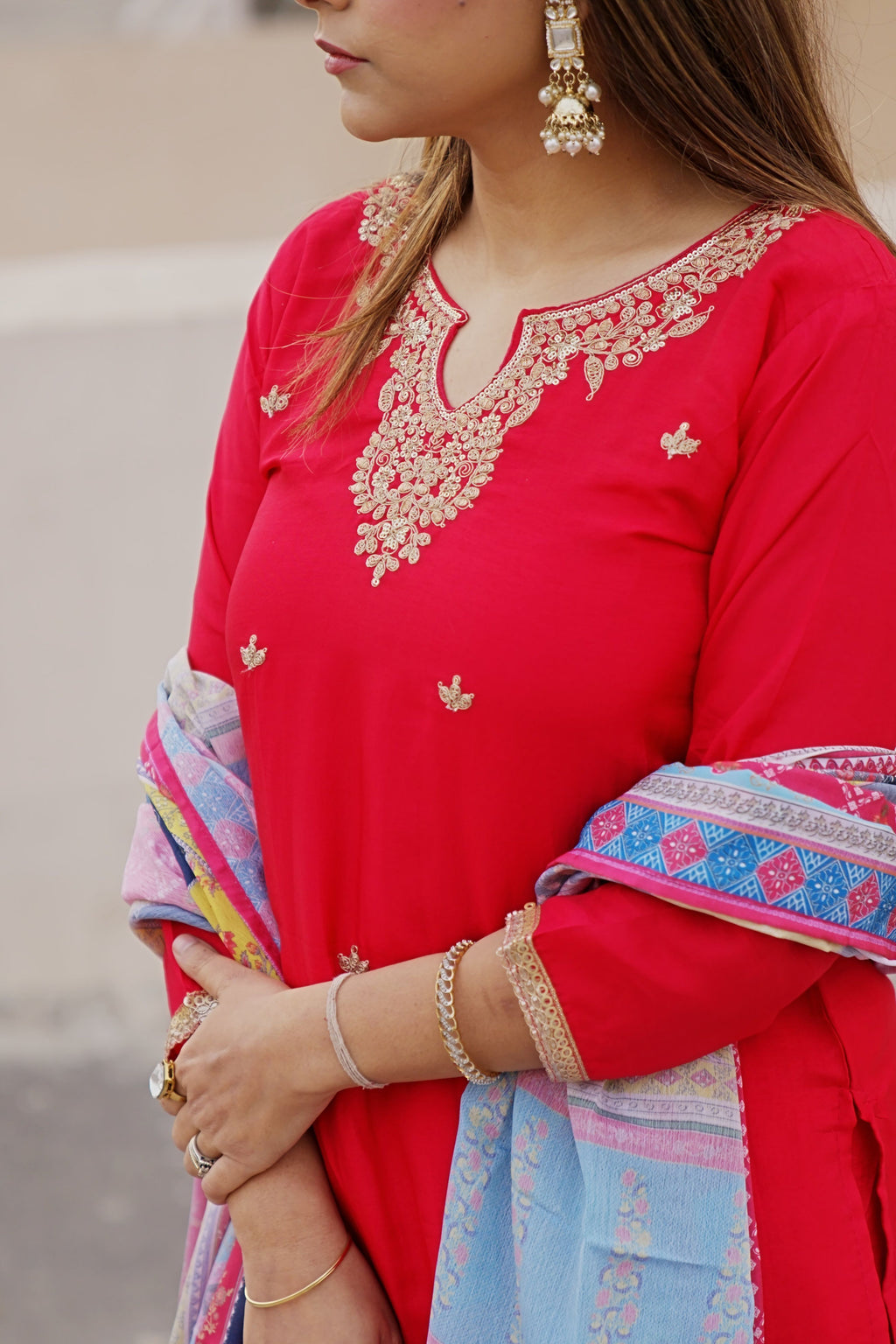 Pink Rani kurta set with floral sharara pants and matching dupatta by Shuchi Man, featuring traditional embroidery and vibrant design.