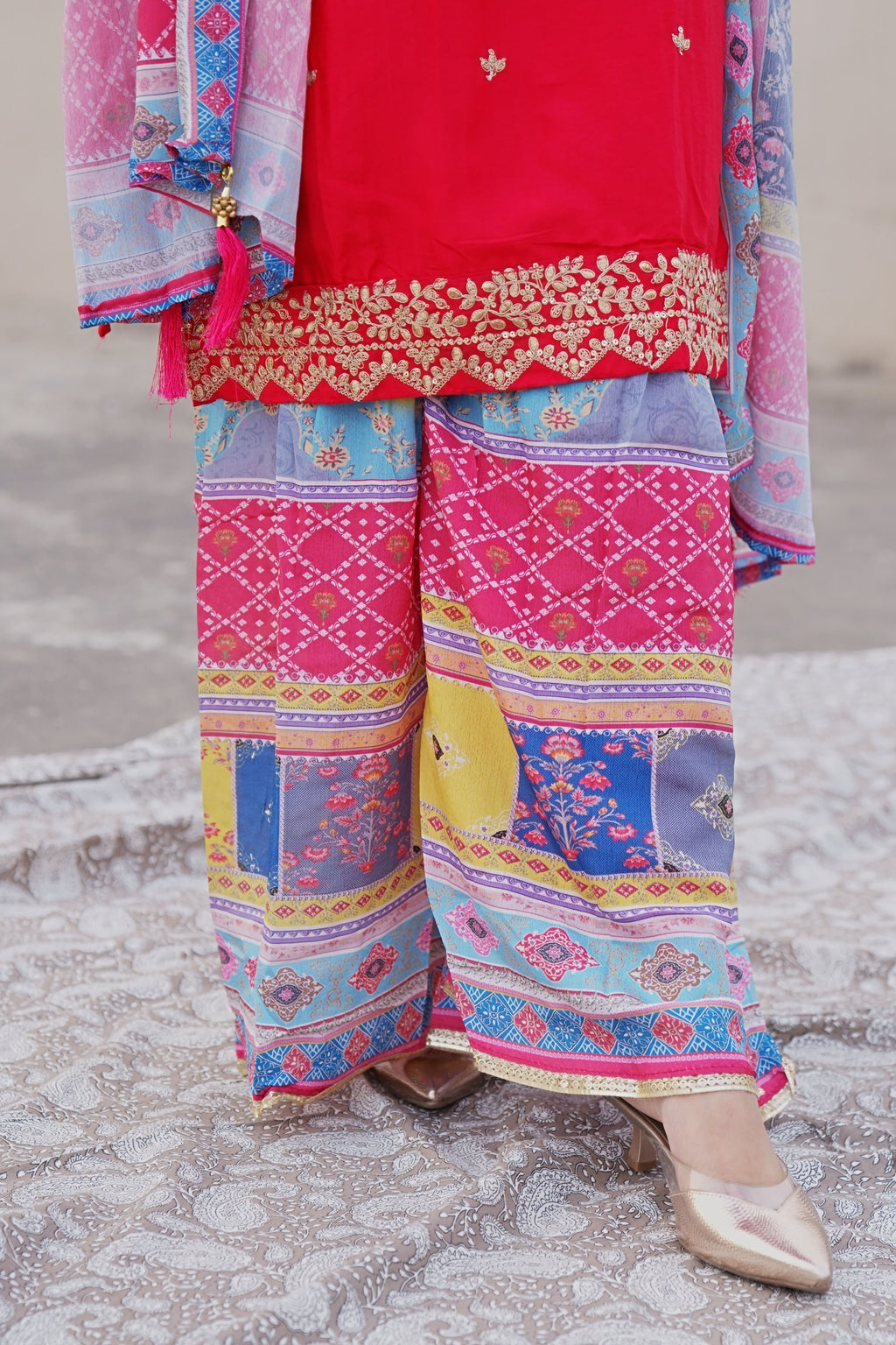 Shuchi Man Rani Pink Kurta set with floral sharara and matching dupatta, featuring intricate embroidery and elegant design.