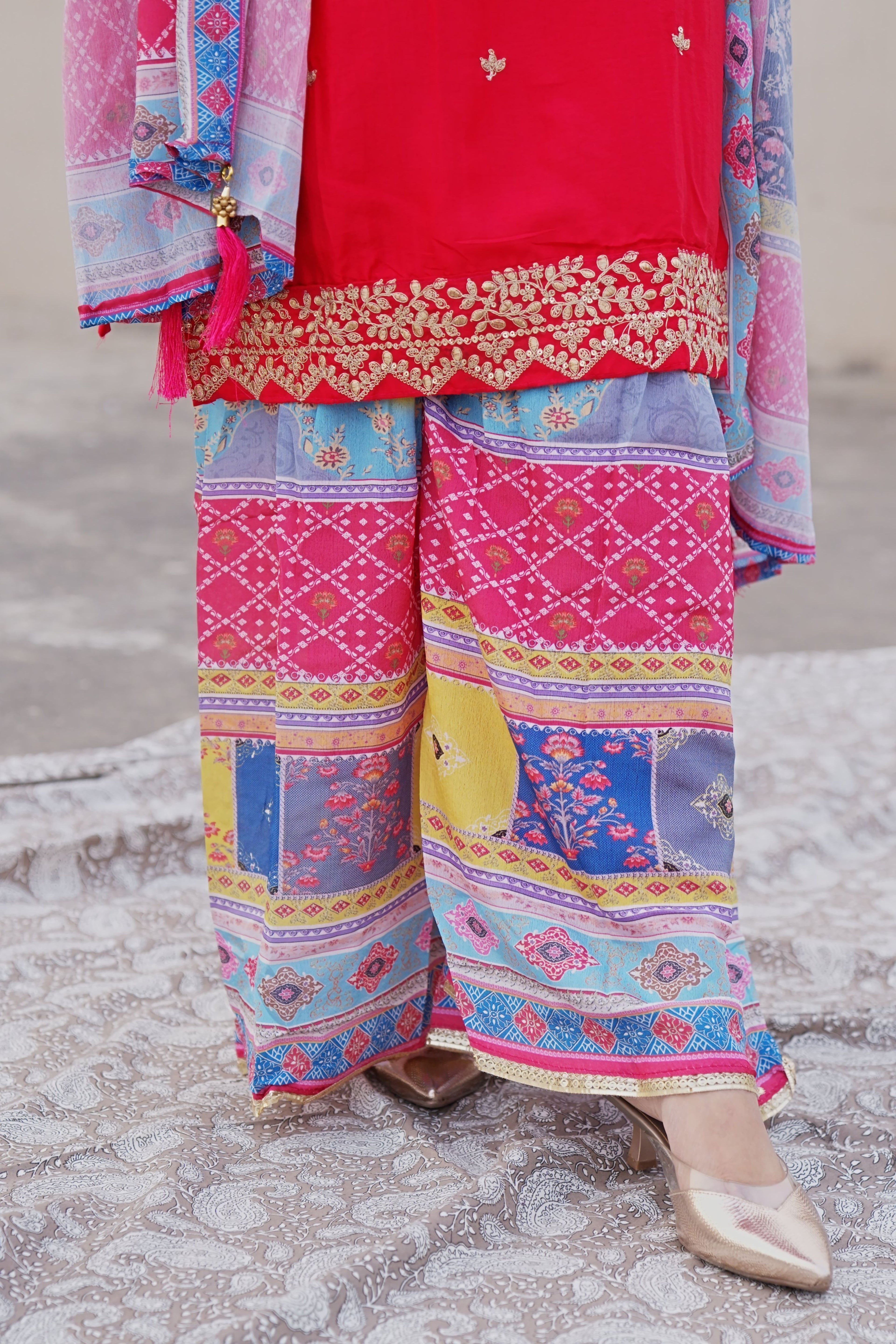 Shuchi Man Rani Pink Kurta set with floral sharara and matching dupatta, featuring intricate embroidery and elegant design.