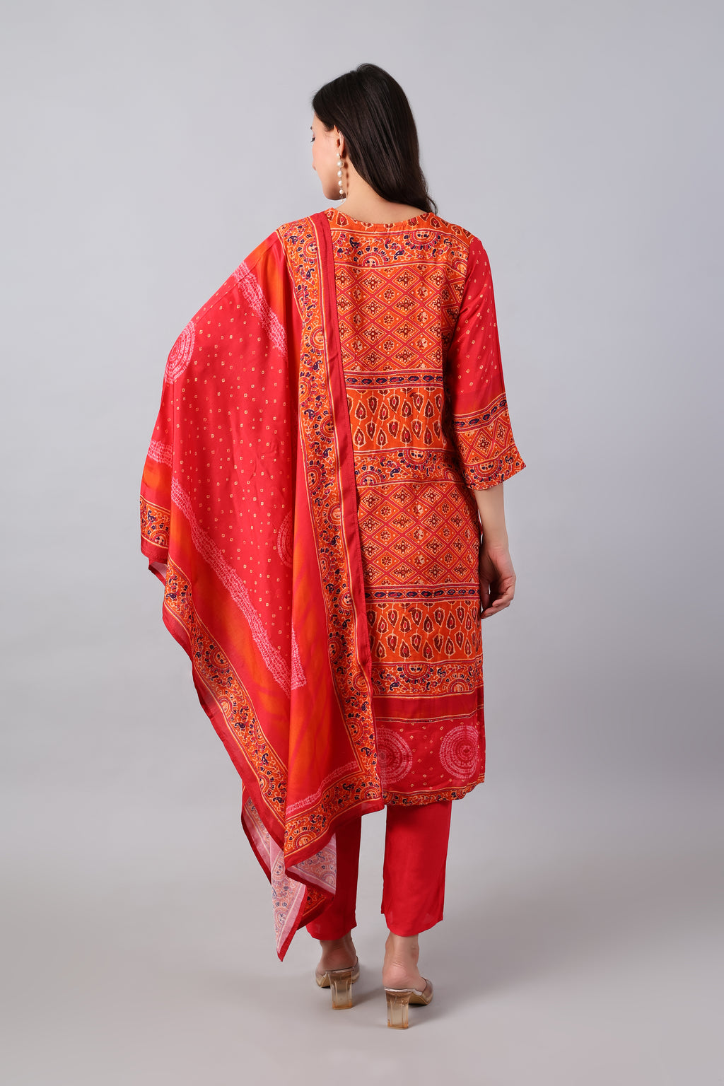 Red Bandhej print rayon kurta set with matching dupatta by Shuchi Man, featuring traditional Indian design and vibrant colors.
