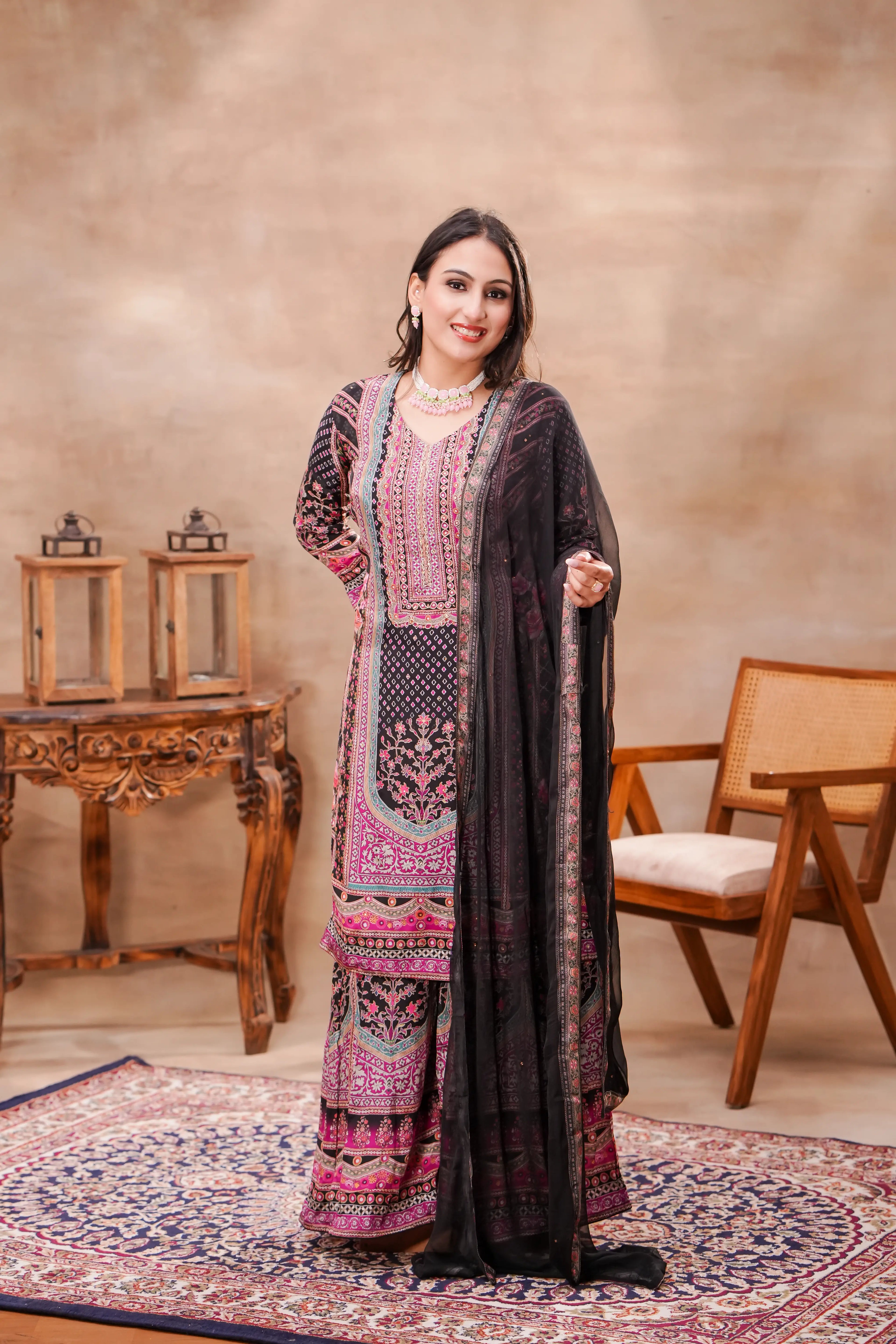 Black and pink printed crepe kurta set with matching dupatta by Shuchi Man, featuring intricate floral design and elegant styling.