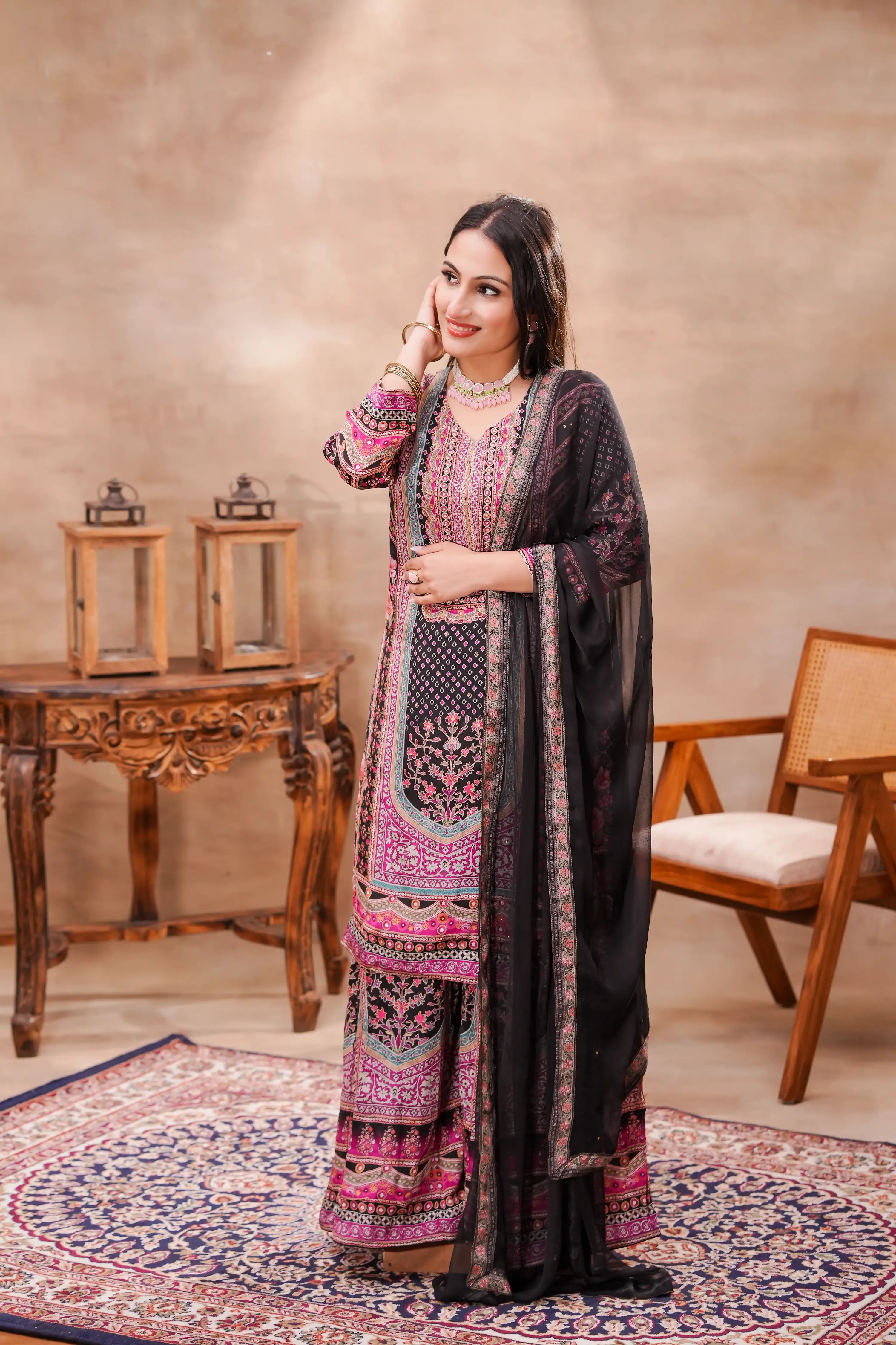 Black and pink printed crepe kurta set with matching dupatta by Shuchi Man, featuring floral patterns and traditional design.