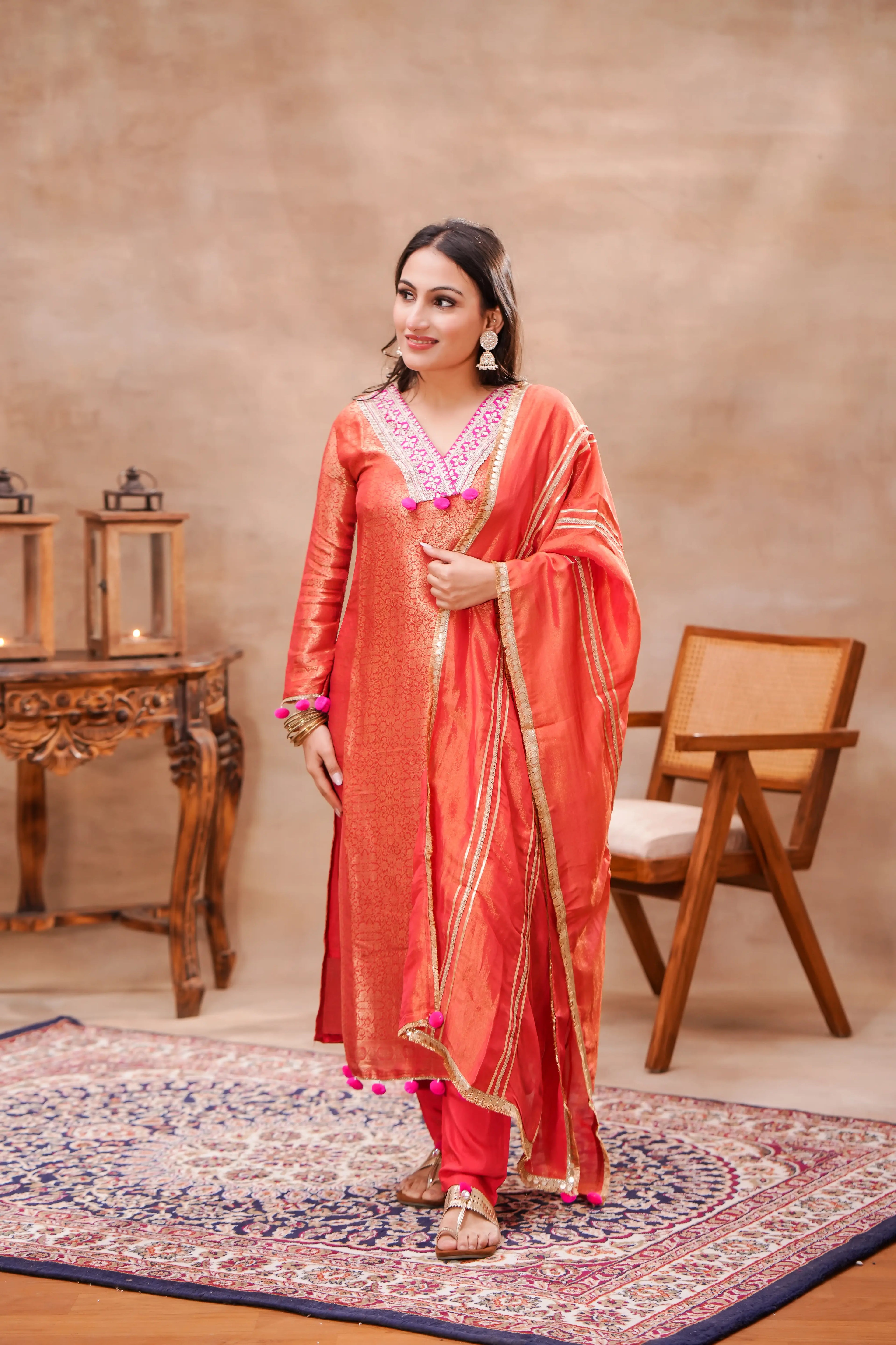 Shuchi Man Vermilion brocade silk kurta set with matching silk dupatta, featuring intricate traditional design for festive wear.
