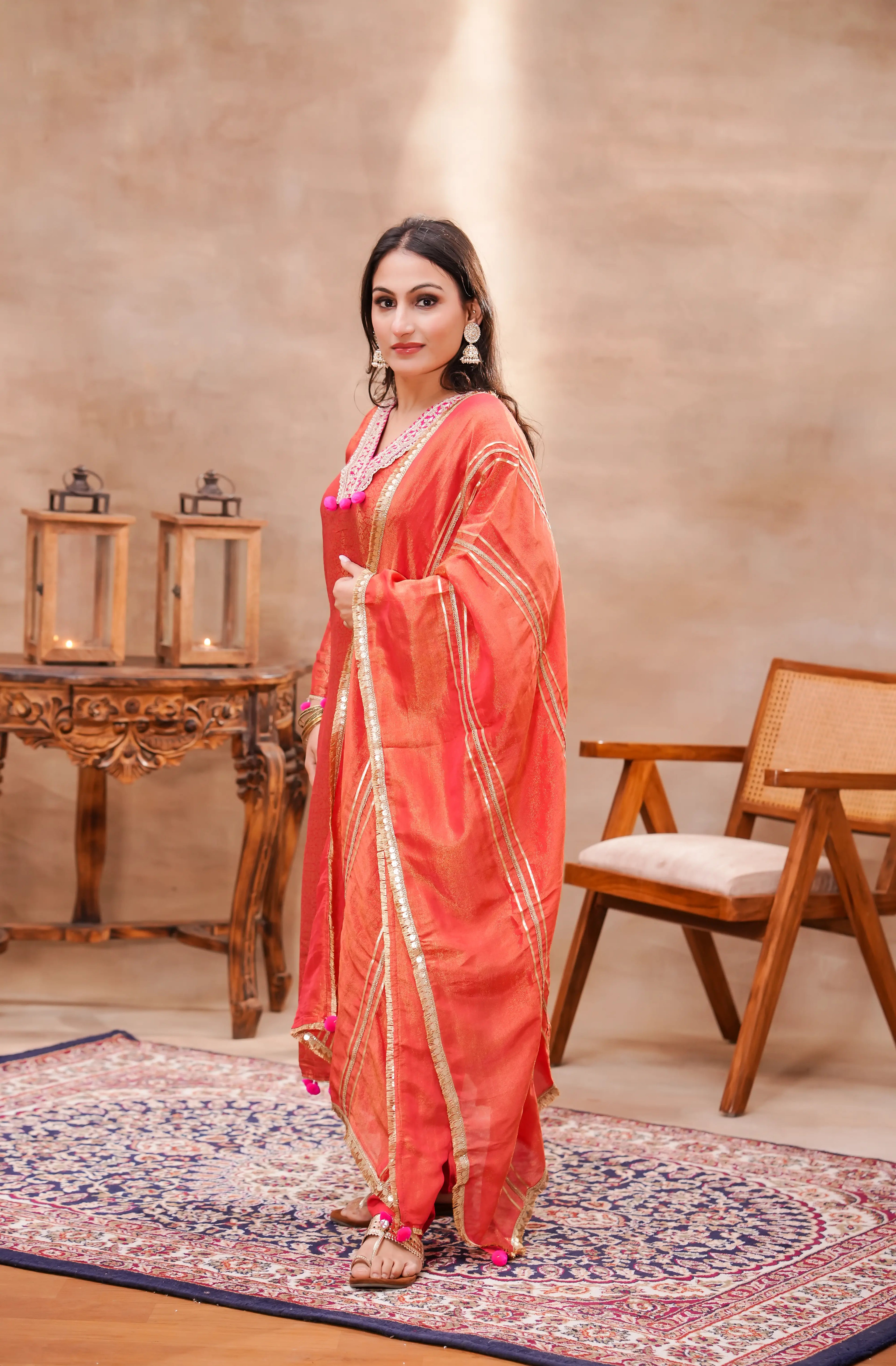 Vermilion brocade silk kurta set with matching silk dupatta by Shuchi Man, featuring intricate traditional embroidery for festive wear.