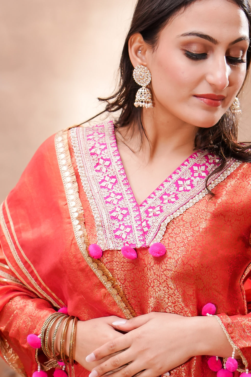 Vermilion brocade silk kurta set with matching silk dupatta by Shuchi Man, featuring intricate traditional embroidery.