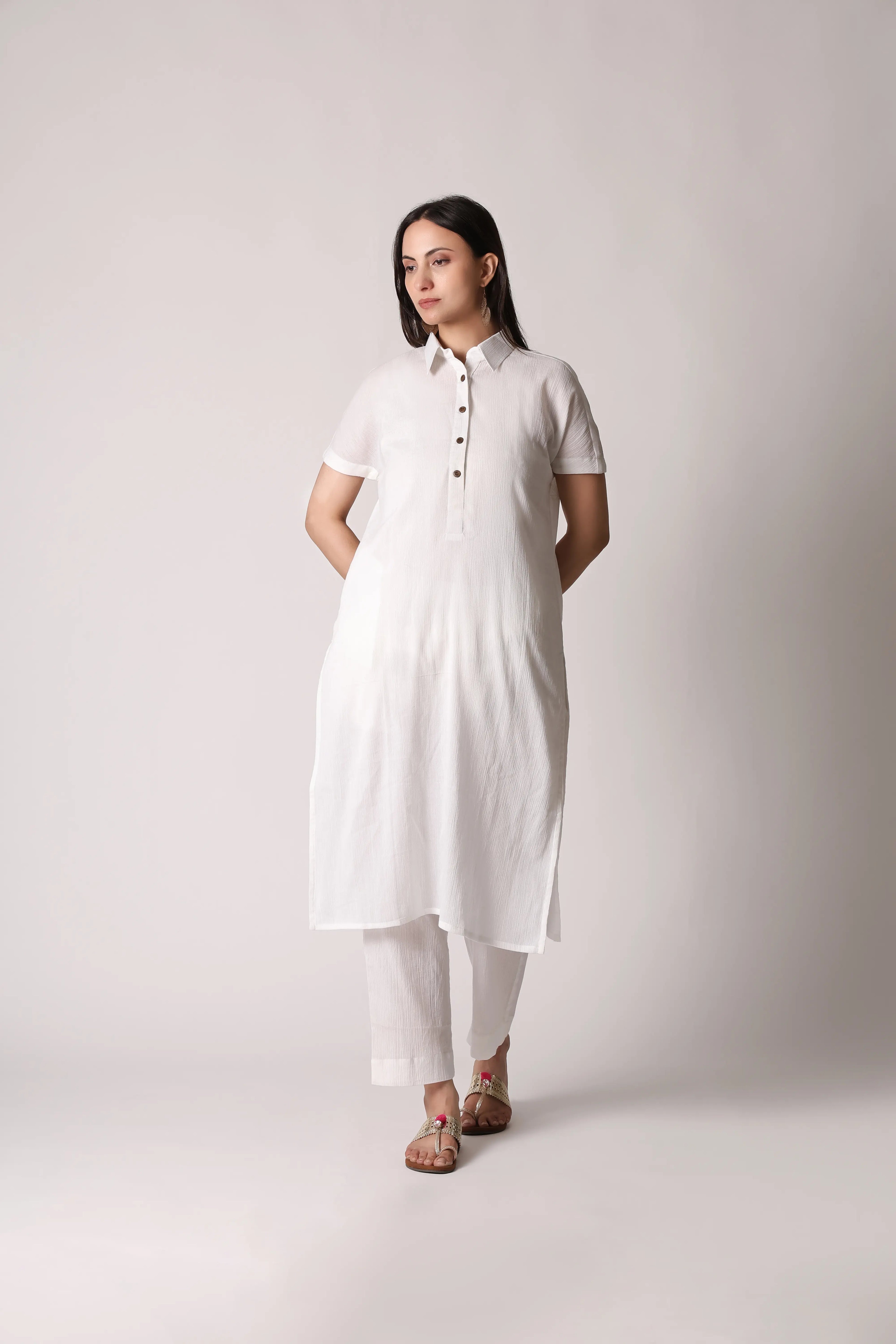 White canvas crinkle co-ord set by Shuchi Man featuring a stylish top and matching pants, perfect for casual and chic looks.