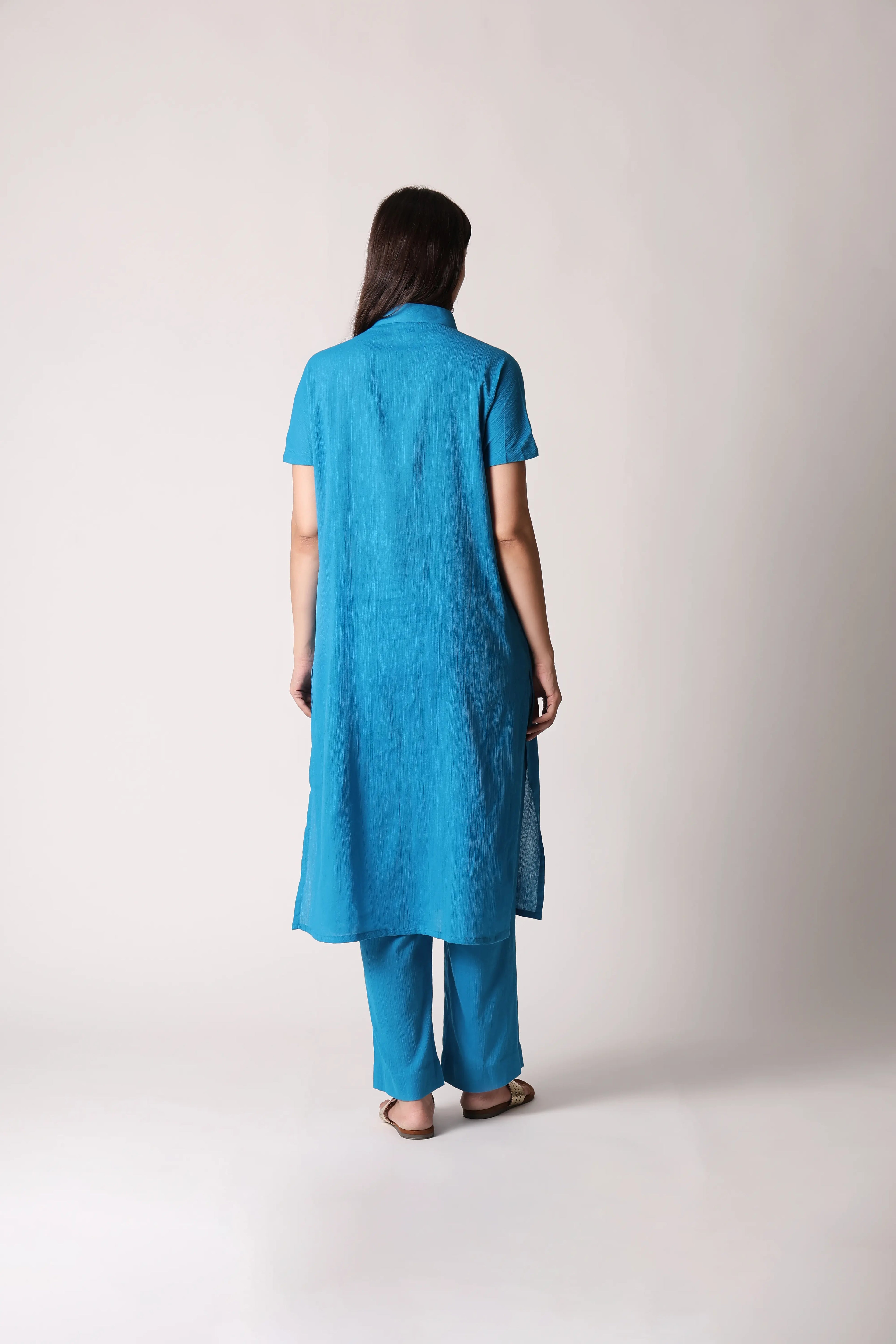 Turquoise drift crinkle co-ord set by Shuchi Man featuring a relaxed fit top and matching wide-leg pants.