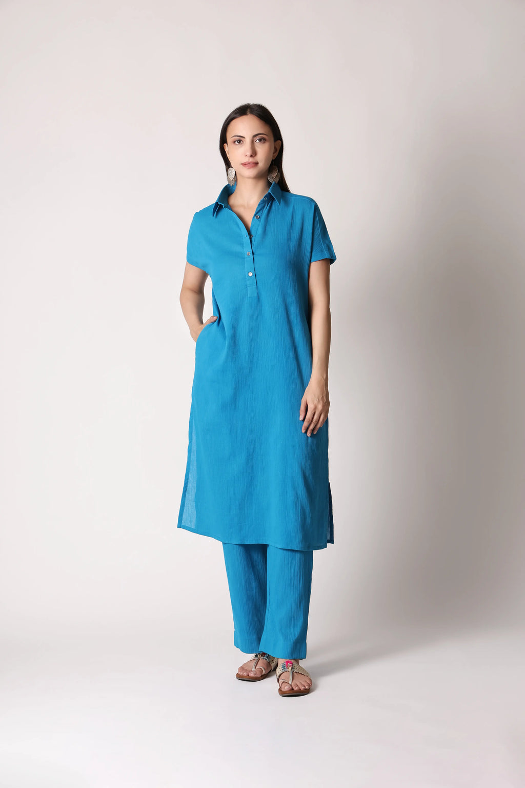 Turquoise drift crinkle co-ord set by Shuchi Man featuring a stylish top and matching pants, perfect for casual or festive wear.