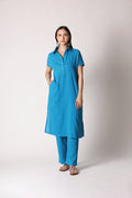 Turquoise drift crinkle co-ord set by Shuchi Man featuring a stylish top and matching pants, perfect for casual or festive wear.