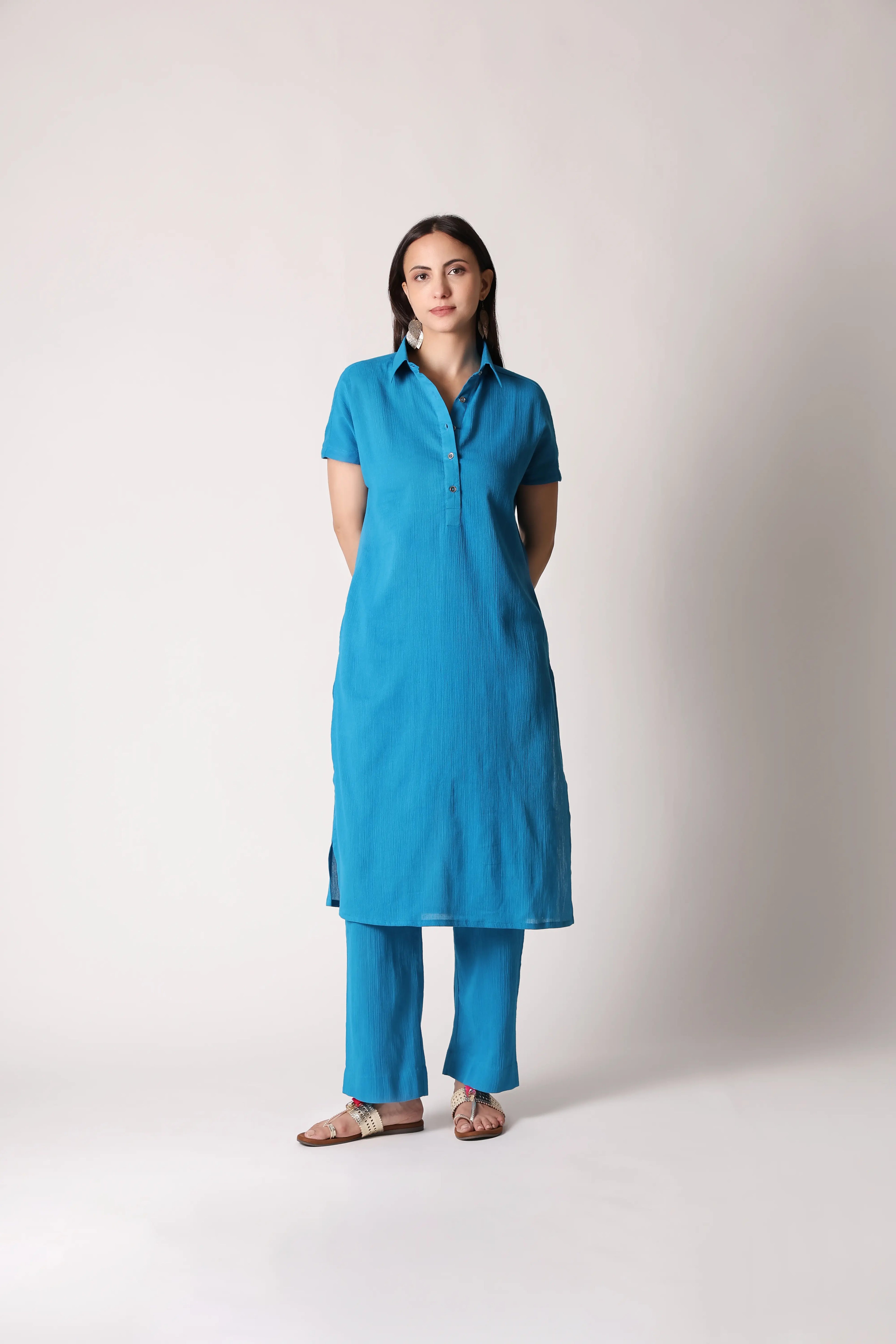 Turquoise drift crinkle co-ord set by Shuchi Man featuring a stylish top and matching pants, perfect for a trendy casual look.