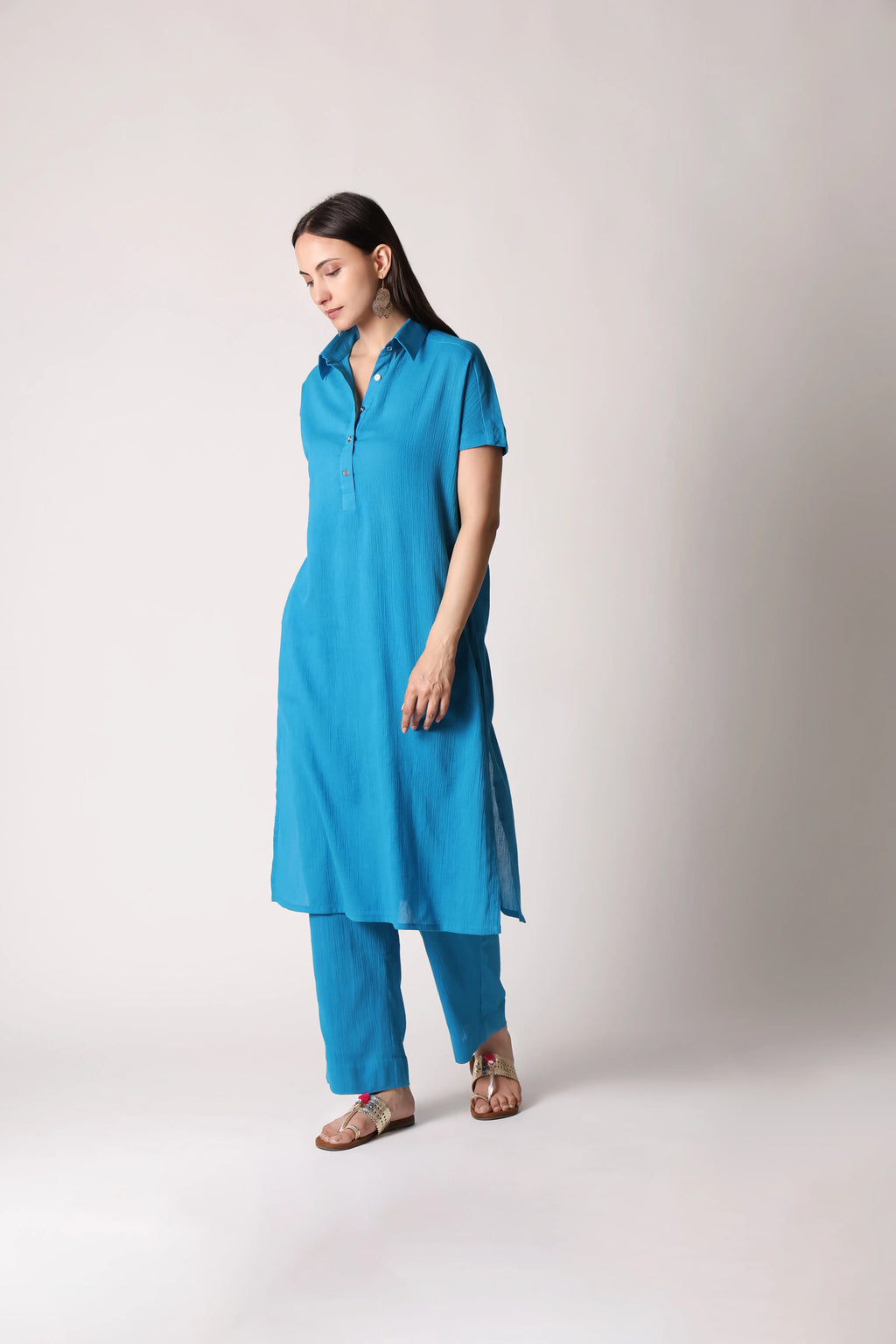 Shuchi Man turquoise drift crinkle co-ord set featuring a top and matching pants, stylish and comfortable for casual wear.