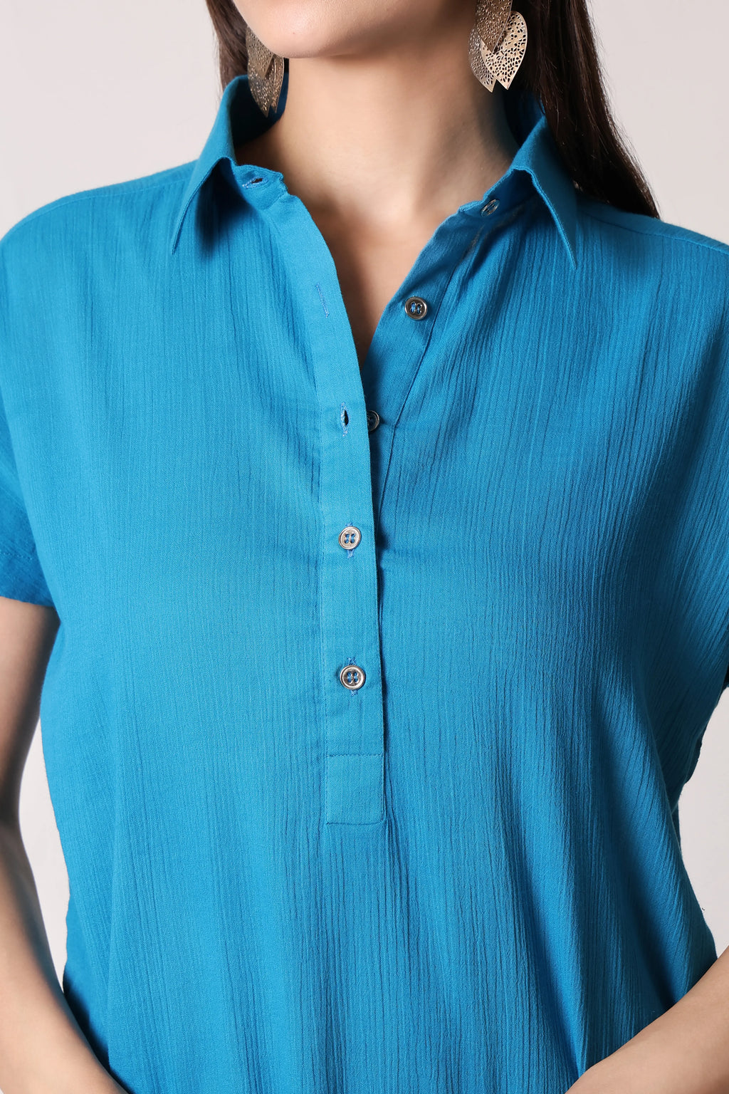 Turquoise drift crinkle co-ord set by Shuchi Man featuring a stylish top and matching pants for a trendy casual look.