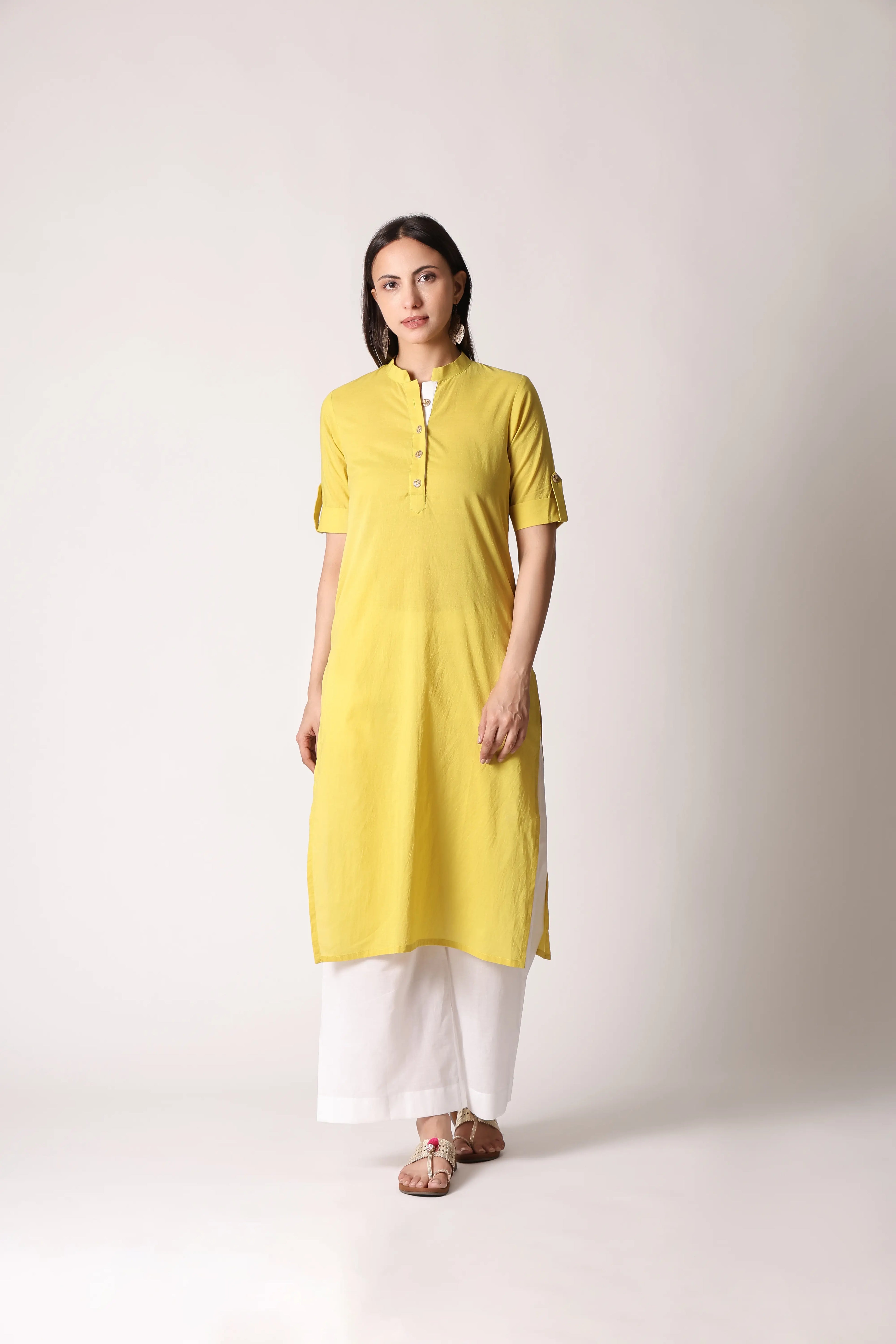Shuchi Man Acacia Edit Cotton Kurta in light fabric with intricate embroidery, displayed on a hanger against a neutral background.
