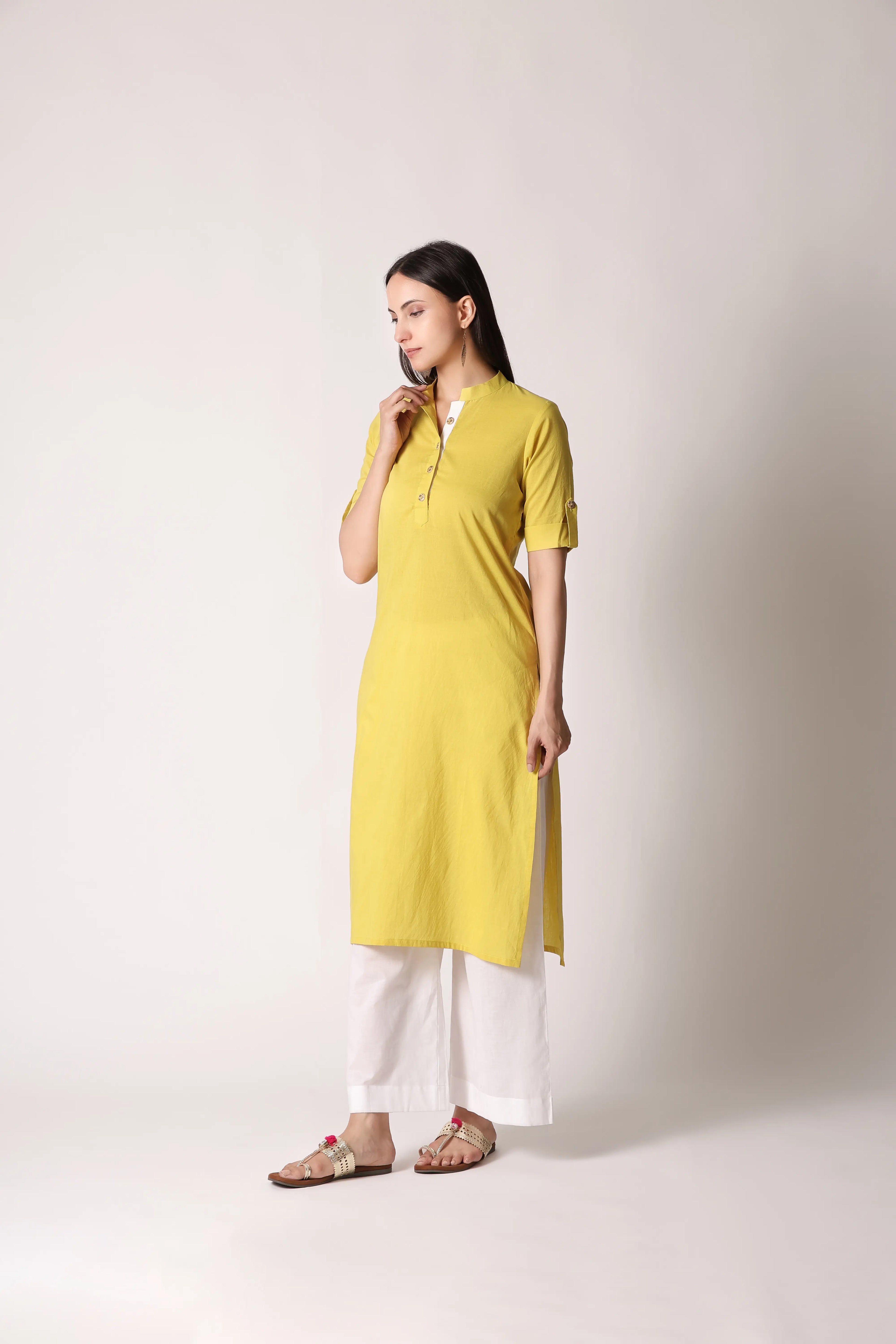 Shuchi Man Acacia Edit Cotton Kurta with intricate embroidery, featuring a classic neckline and long sleeves, displayed on a hanger.