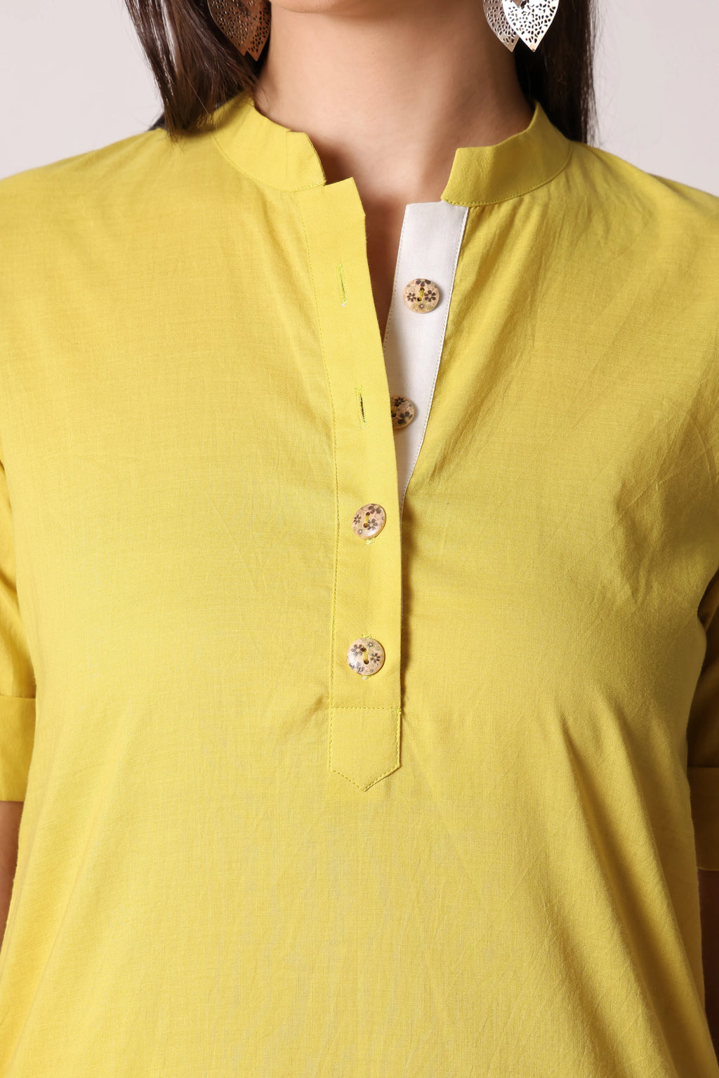 Shuchi Man Acacia Edit cotton kurta featuring traditional design, light fabric, and intricate embroidery on a neutral-colored fabric.