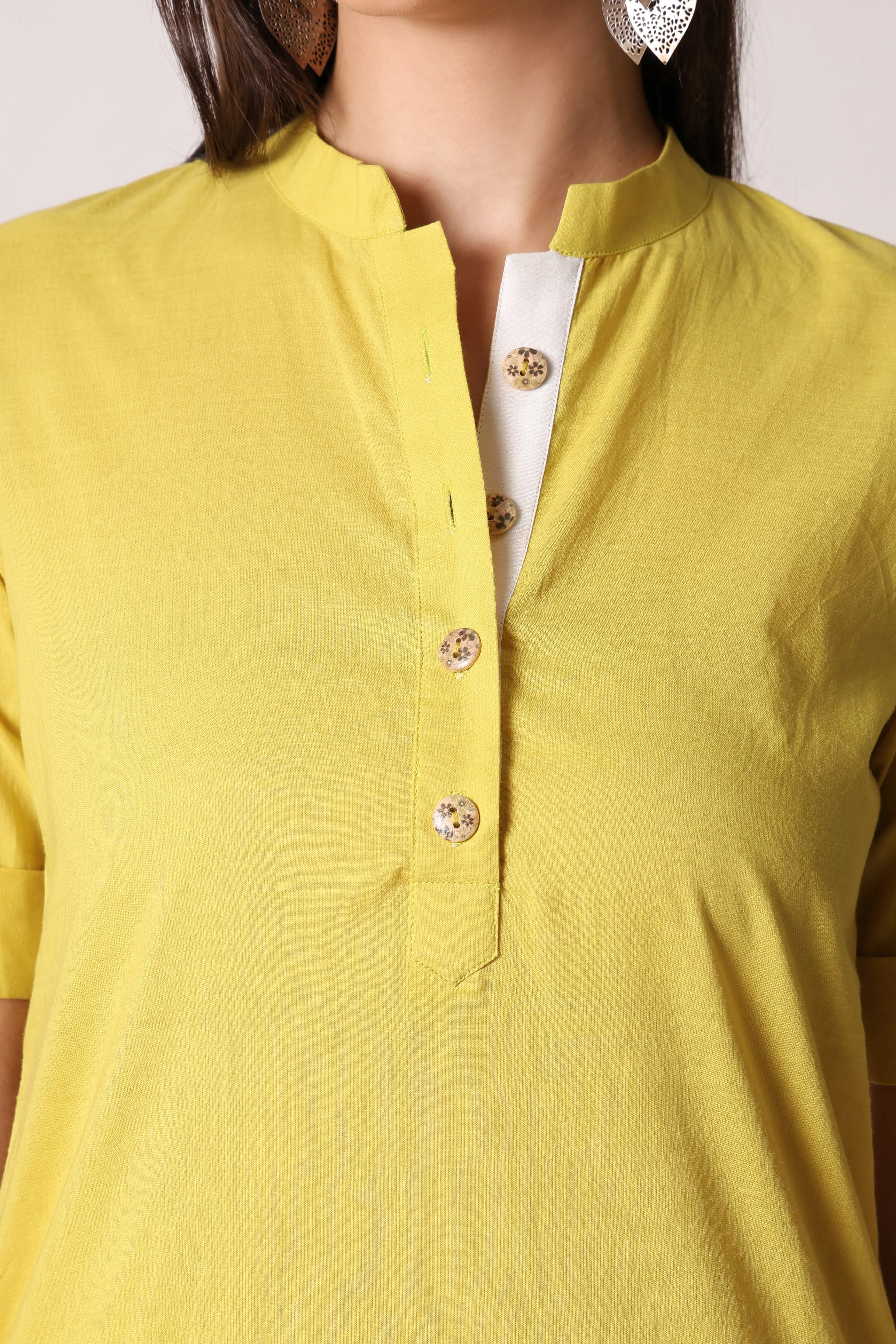 Shuchi Man Acacia Edit cotton kurta featuring traditional design, light fabric, and intricate embroidery on a neutral-colored fabric.
