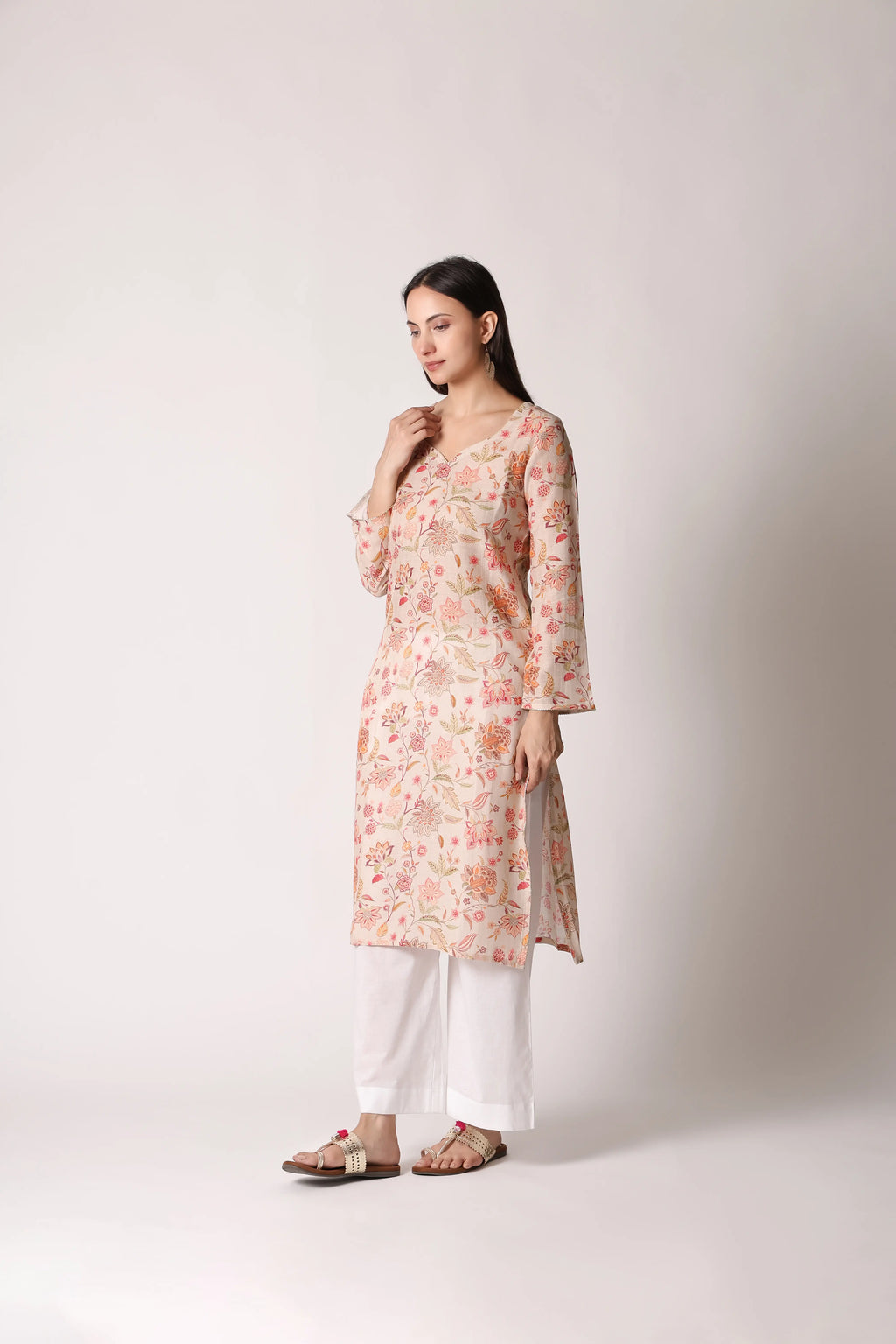 Ivory Reverie Linen Viscose printed kurta by Shuchi Man featuring floral patterns and a relaxed fit, displayed on a hanger.