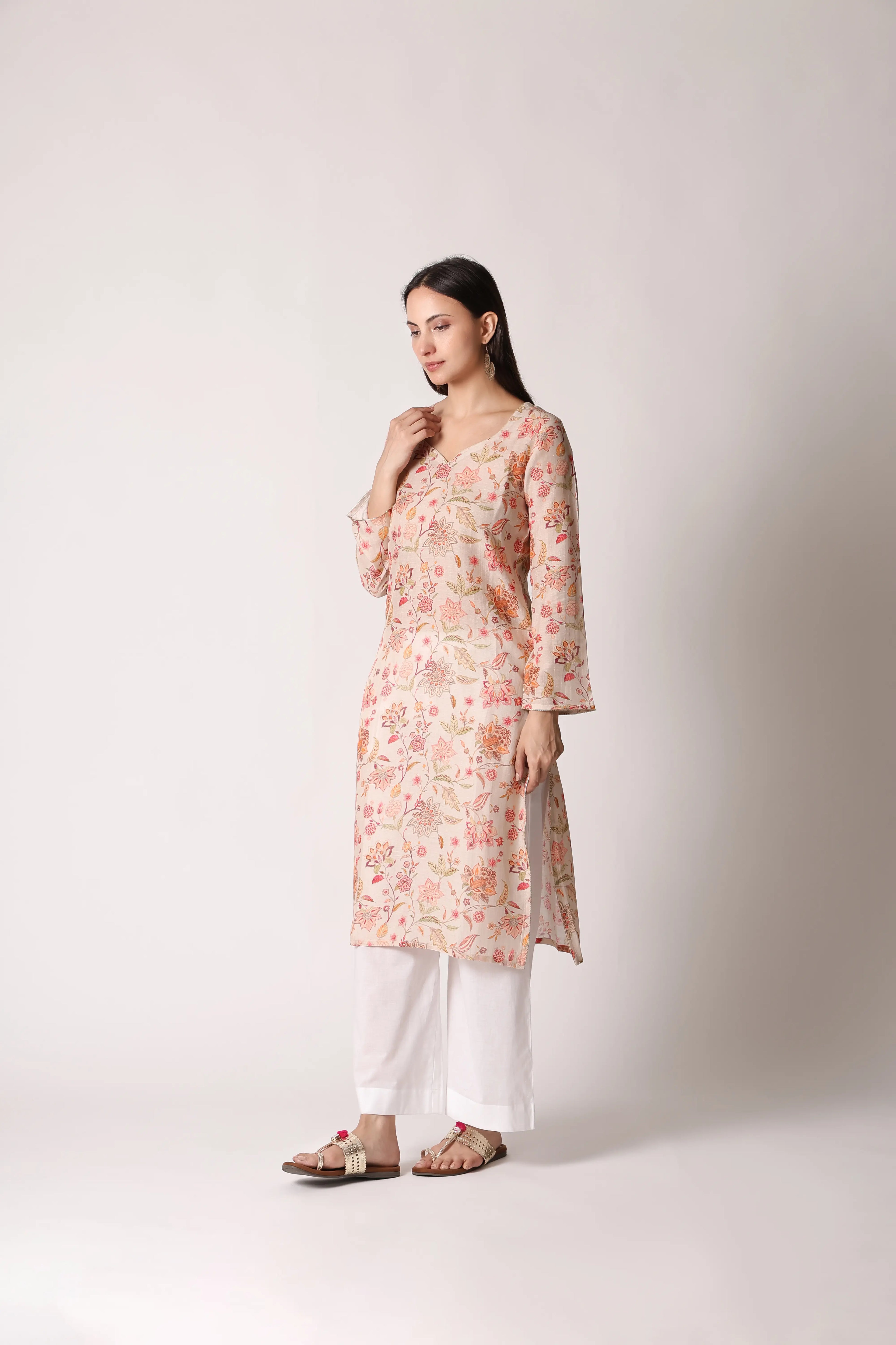 Ivory Reverie Linen Viscose printed kurta by Shuchi Man featuring floral patterns and a relaxed fit, displayed on a hanger.