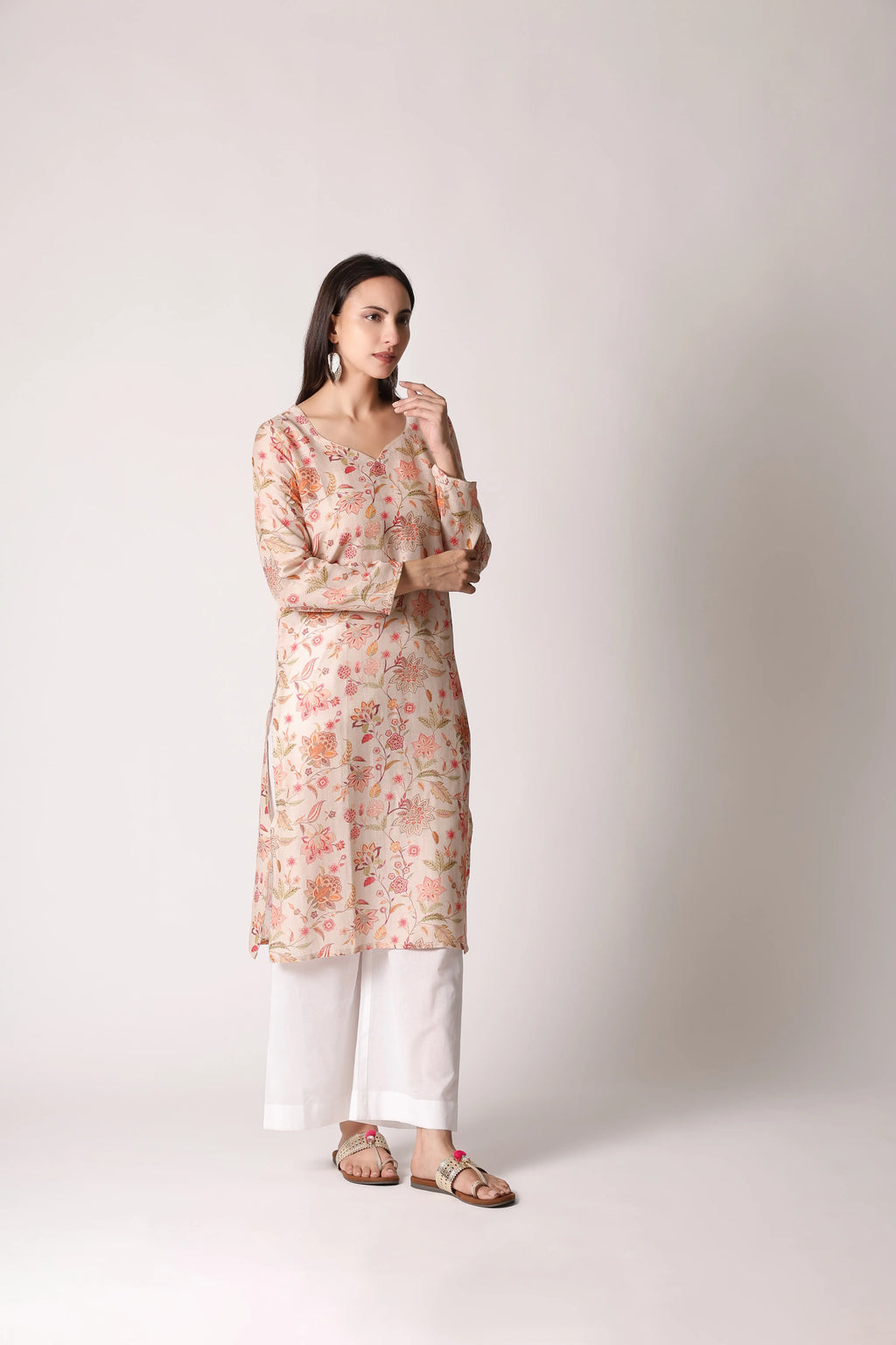 Ivory Reverie linen viscose printed kurta by Shuchi Man with floral patterns and a relaxed fit, displayed on a hanger.