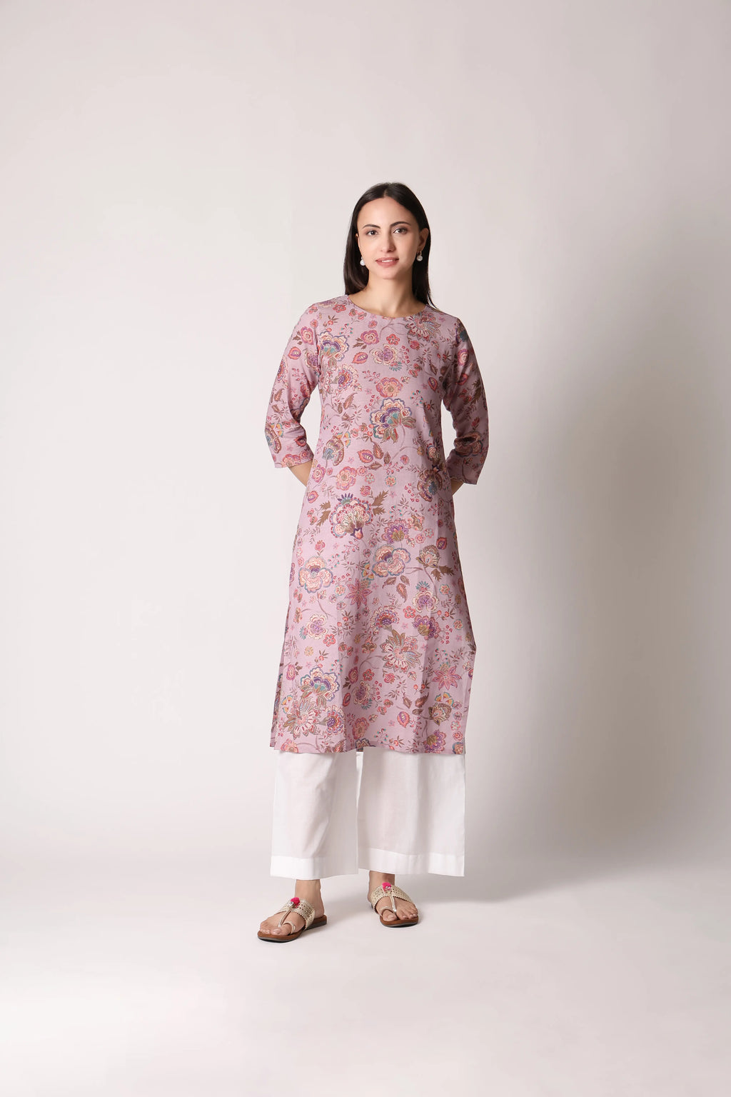 Lilac Lilt Pure Linen Printed Kurta by Shuchi Man displayed on a hanger, showcasing its floral design and lightweight fabric.