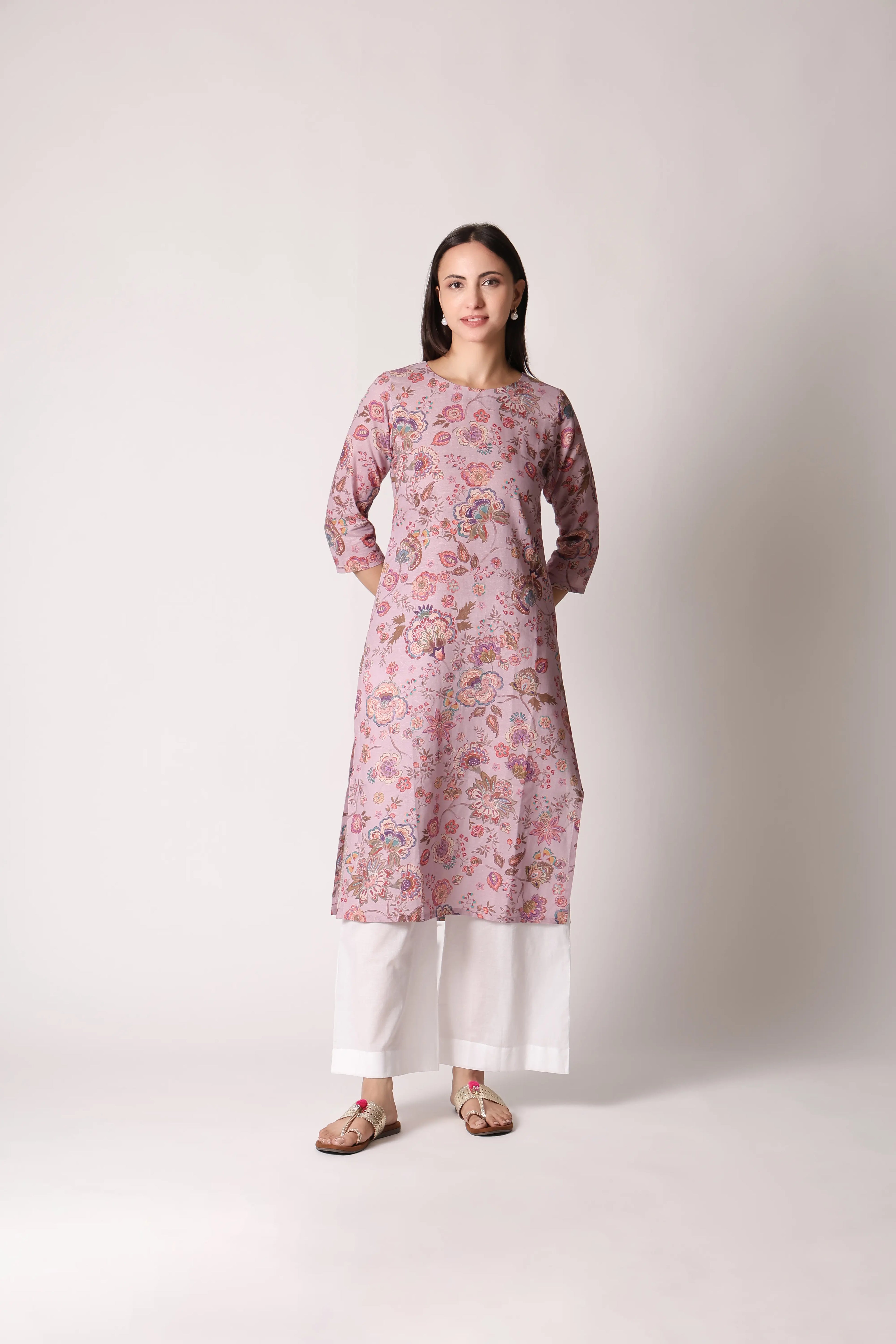 Lilac Lilt Pure Linen Printed Kurta by Shuchi Man displayed on a hanger, showcasing its floral design and lightweight fabric.