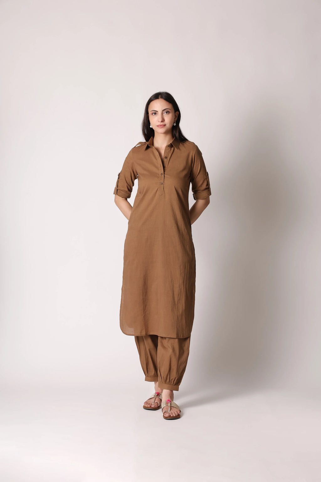 Khaki Nomad Pathani co-ord set by Shuchi Man displayed on a hanger, featuring traditional design with modern style elements.