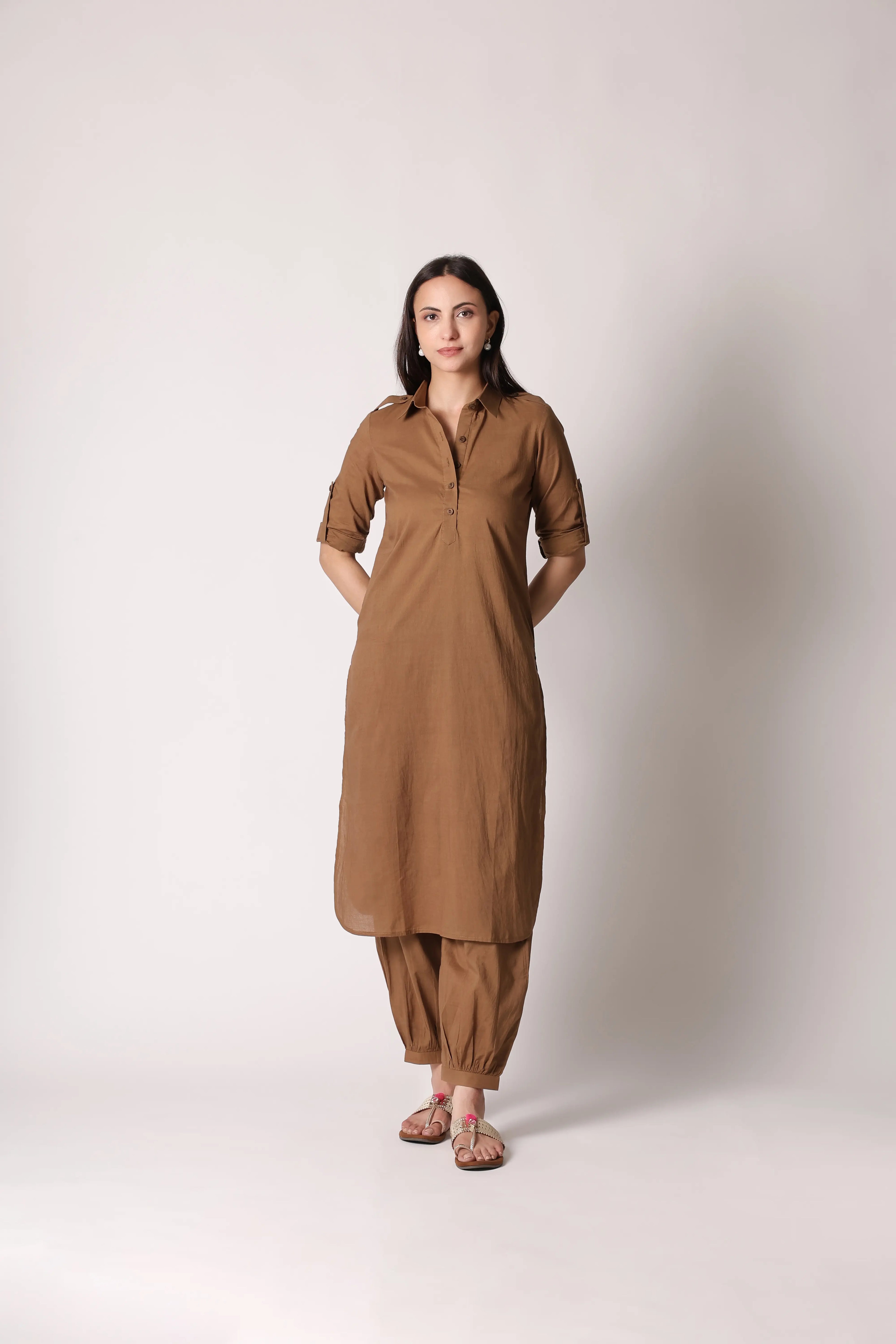 Khaki Nomad Pathani co-ord set by Shuchi Man displayed on a hanger, featuring traditional design with modern style elements.