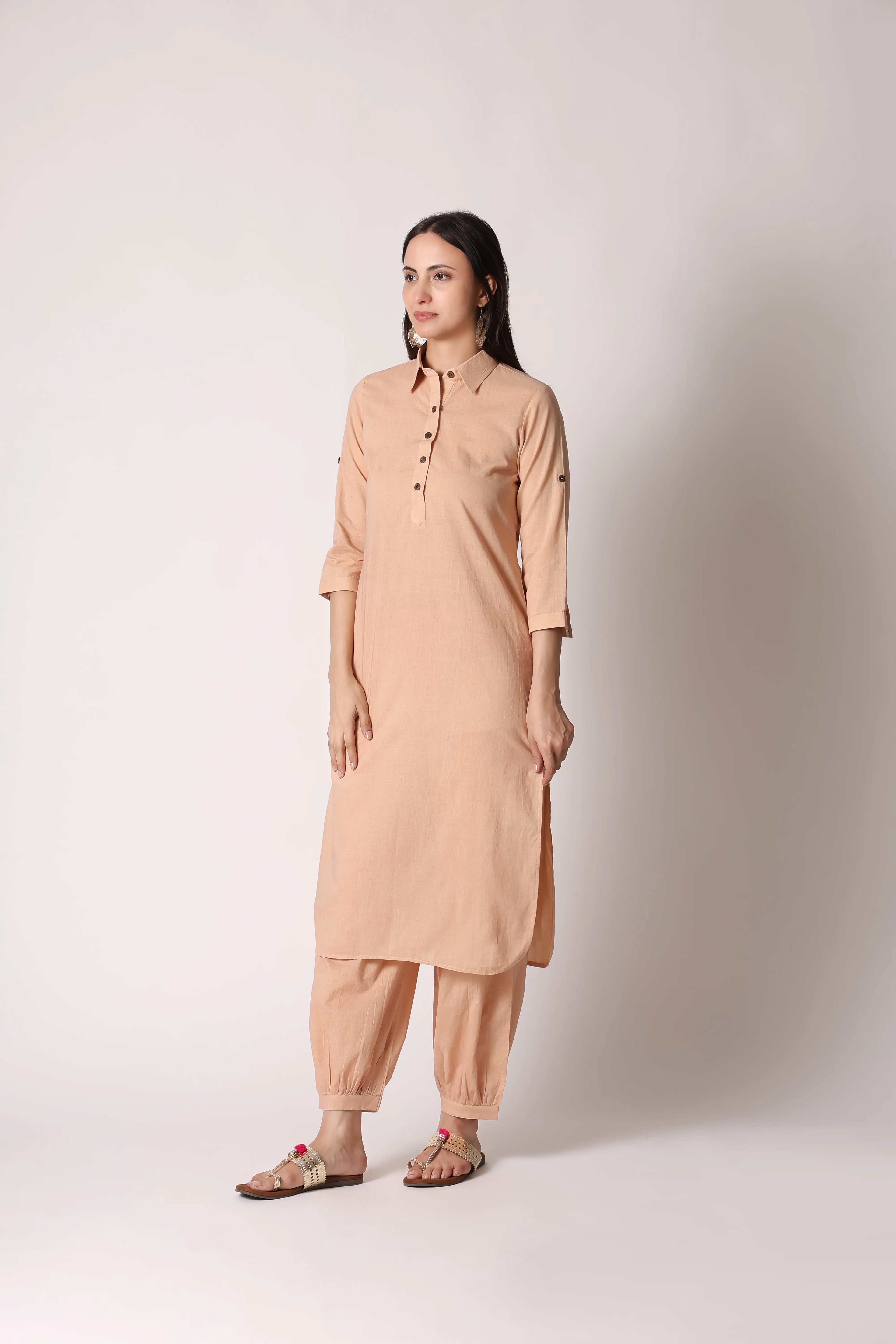 Shuchi Man Sandy Nomad Pathani co-ord set featuring a fitted top and matching wide-leg pants in neutral tones.