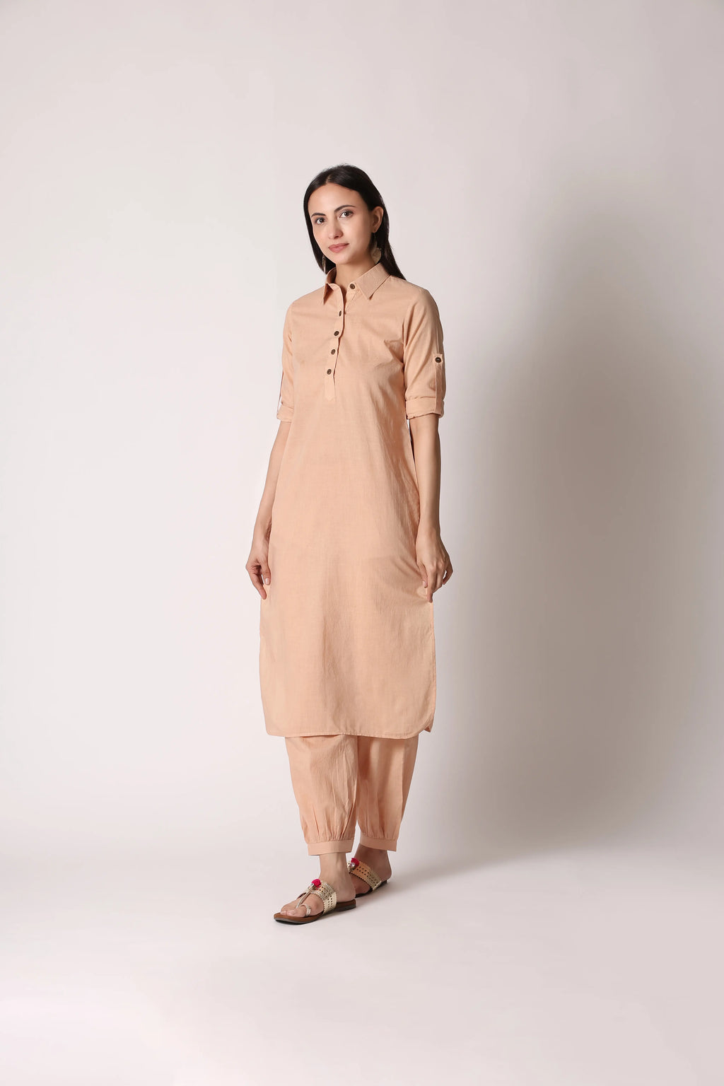 Shuchi Man Sandy Nomad Pathani co-ord set featuring a beige and brown traditional kurta with matching pants and intricate embroidery.