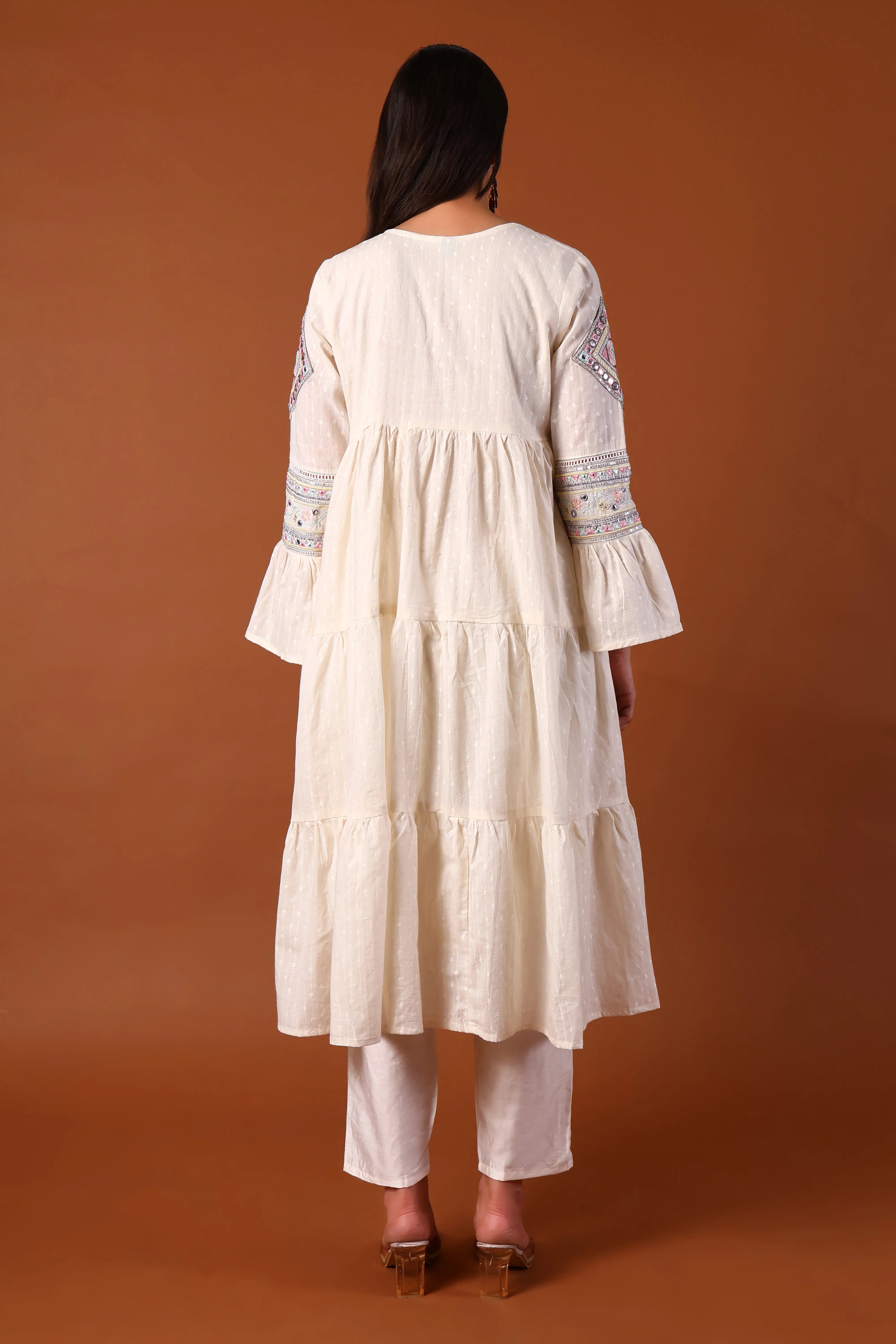 Ivory cotton kurta set with Kauri embellishments by Shuchi Man, featuring intricate embroidery and a traditional design.