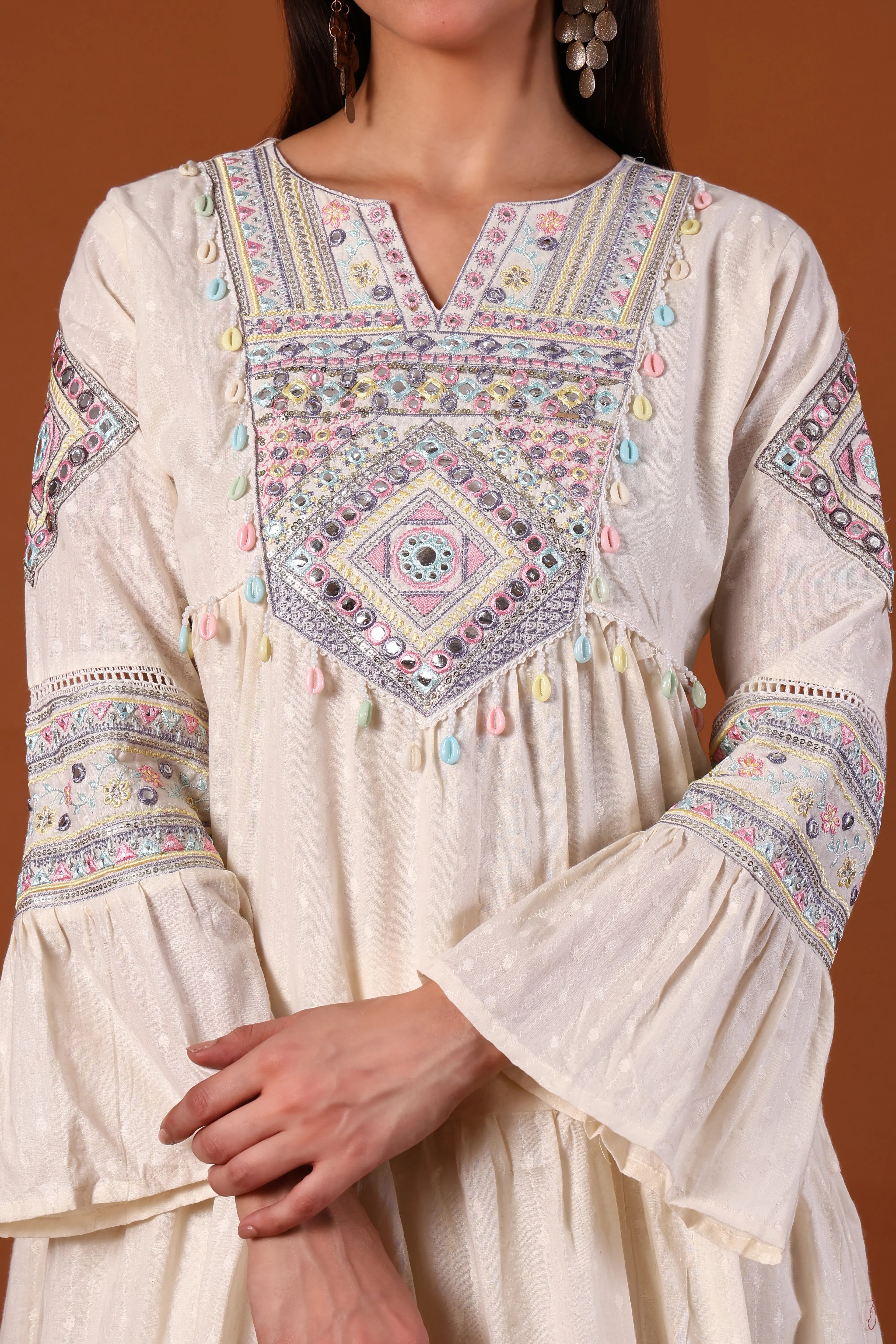 Ivory cotton kurta set with Kauri embellishments by Shuchi Man, featuring intricate embroidery and traditional design.
