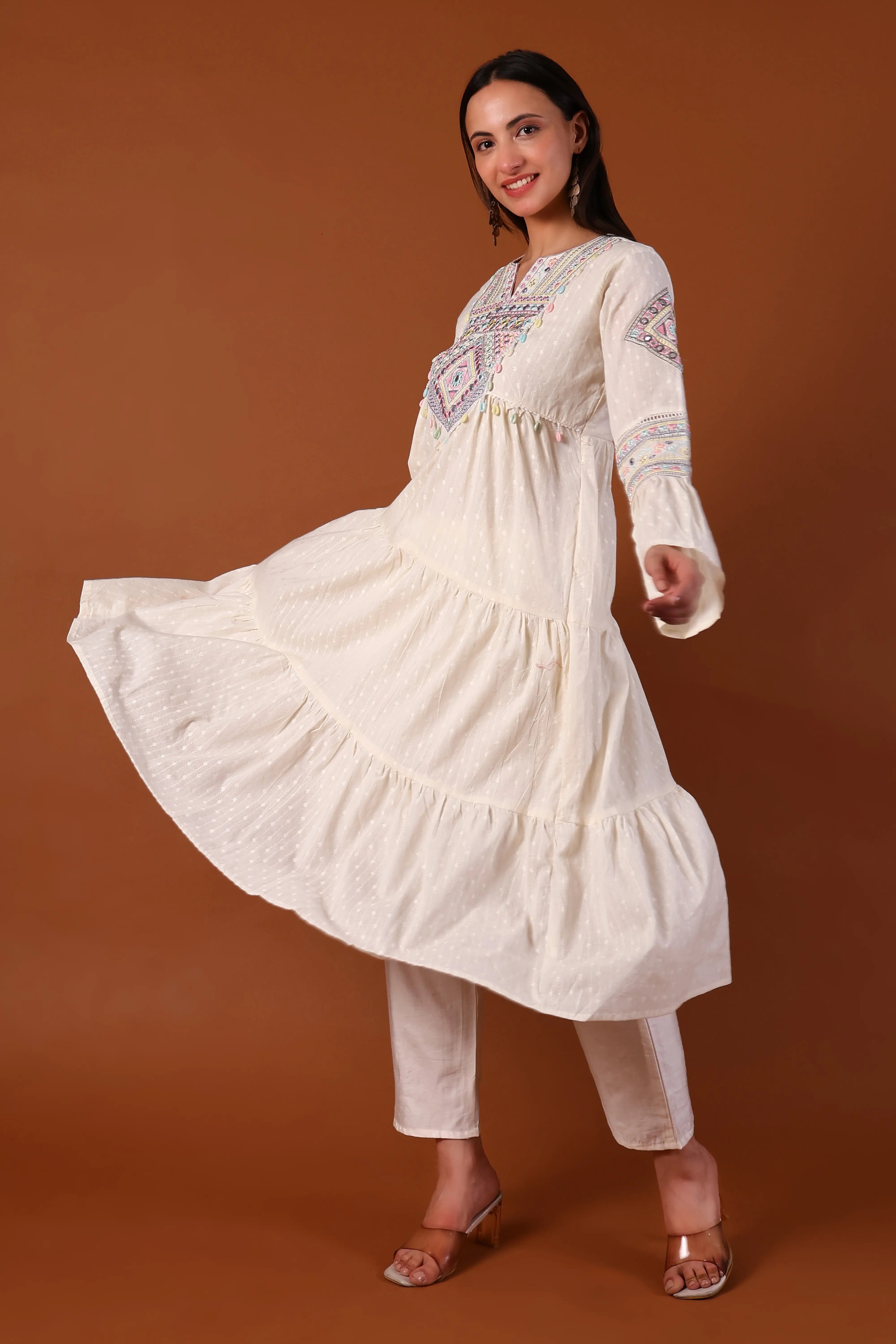 Ivory cotton kurta set with intricate kauri embellishments by Shuchi Man, featuring a traditional and elegant design.