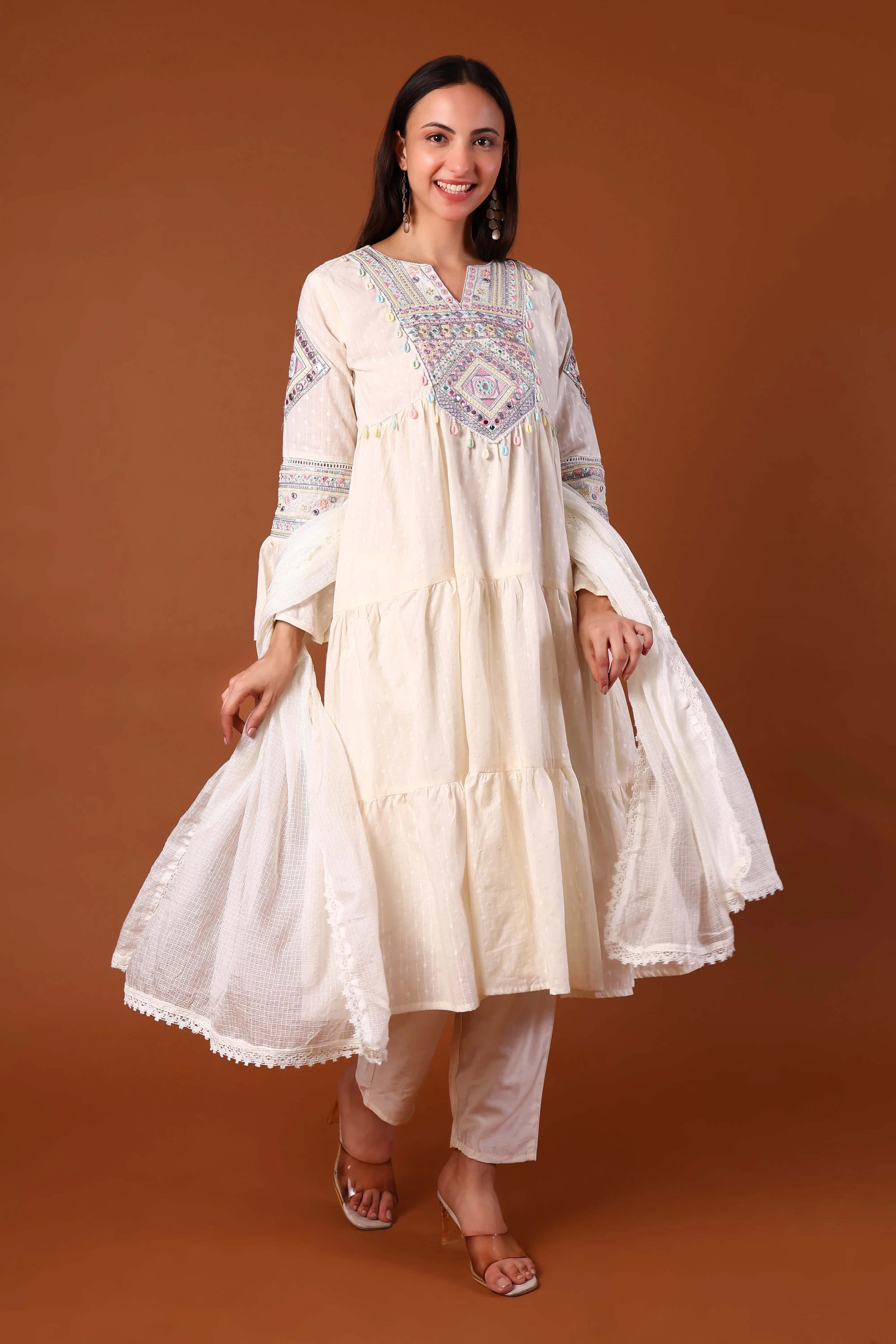 Ivory cotton kurta set with Kauri embellishments by Shuchi Man, featuring a traditional design and intricate embroidery.