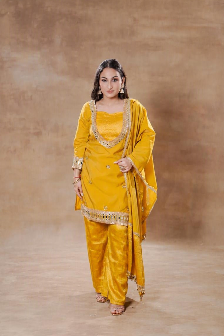 Yellow silk mirror work festive kurta set with matching pants and dupatta by Shuchi Man, showcasing intricate embroidery and vibrant color.