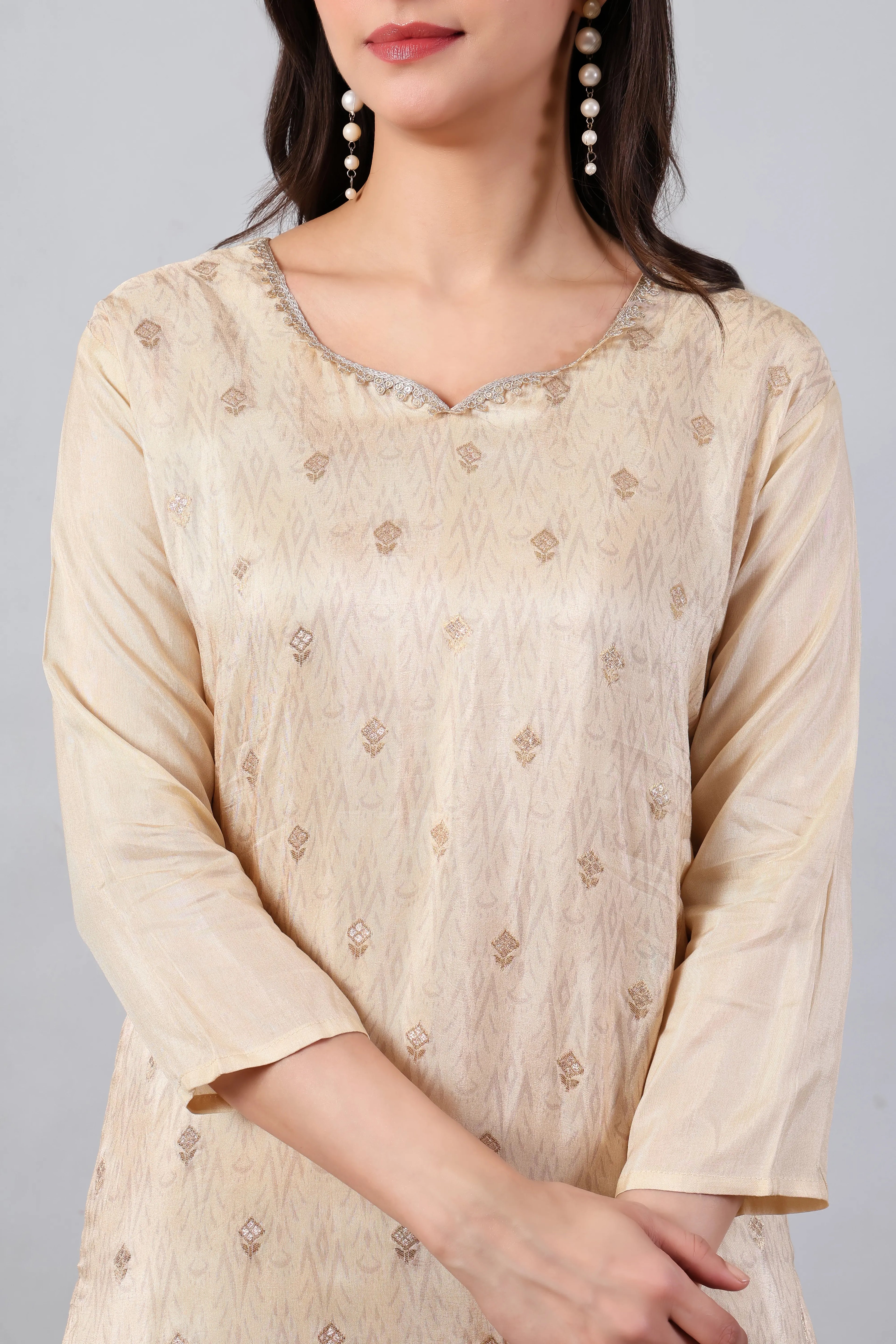 Ivory Russian silk kurta set with red panel top and zari embroidery by Shuchi Man, showcasing traditional Indian attire.